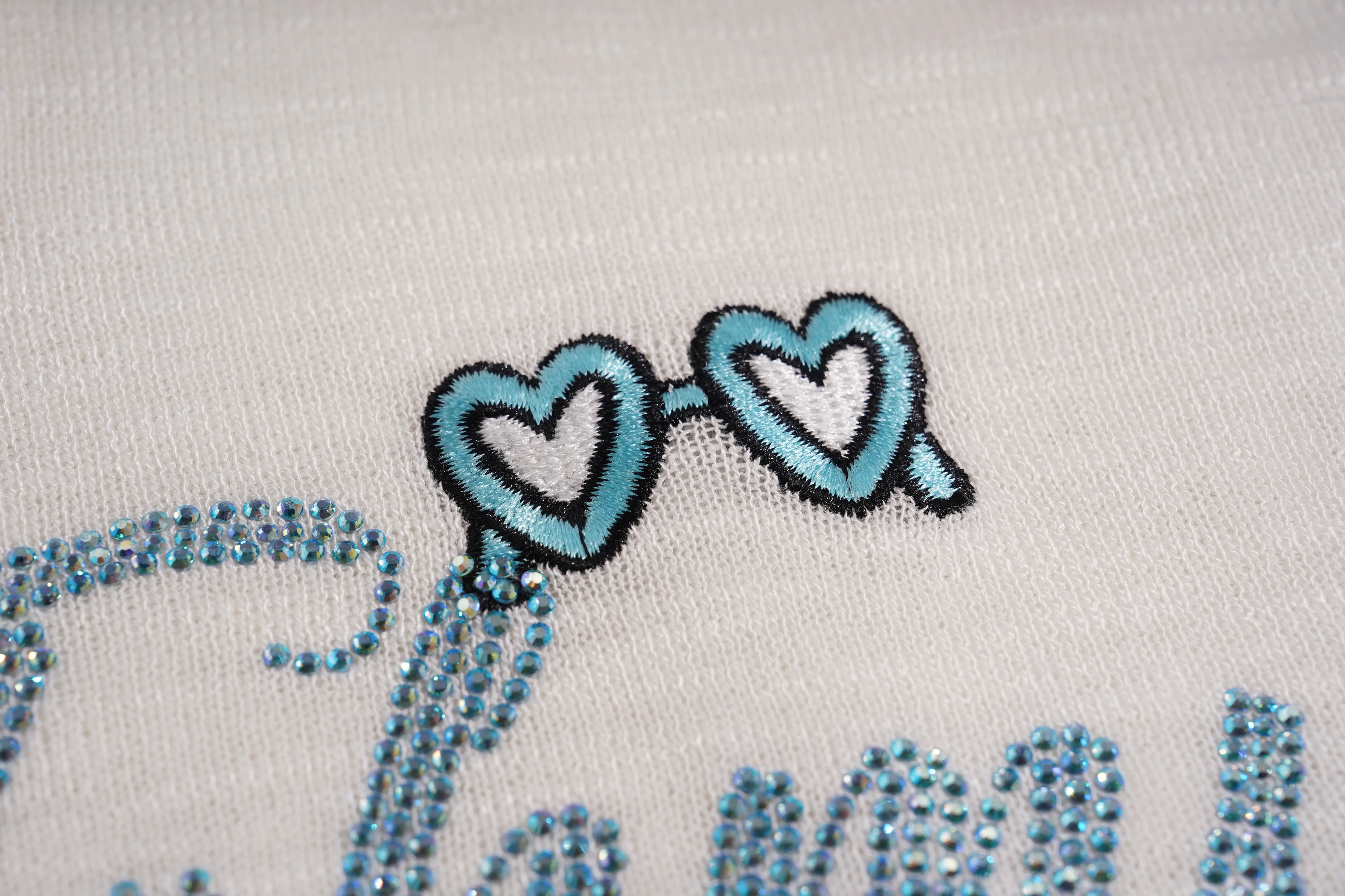 Embroidered sunglasses with heart shapes on a white background, TCH White Rhinestone Bow Knit Cardigan