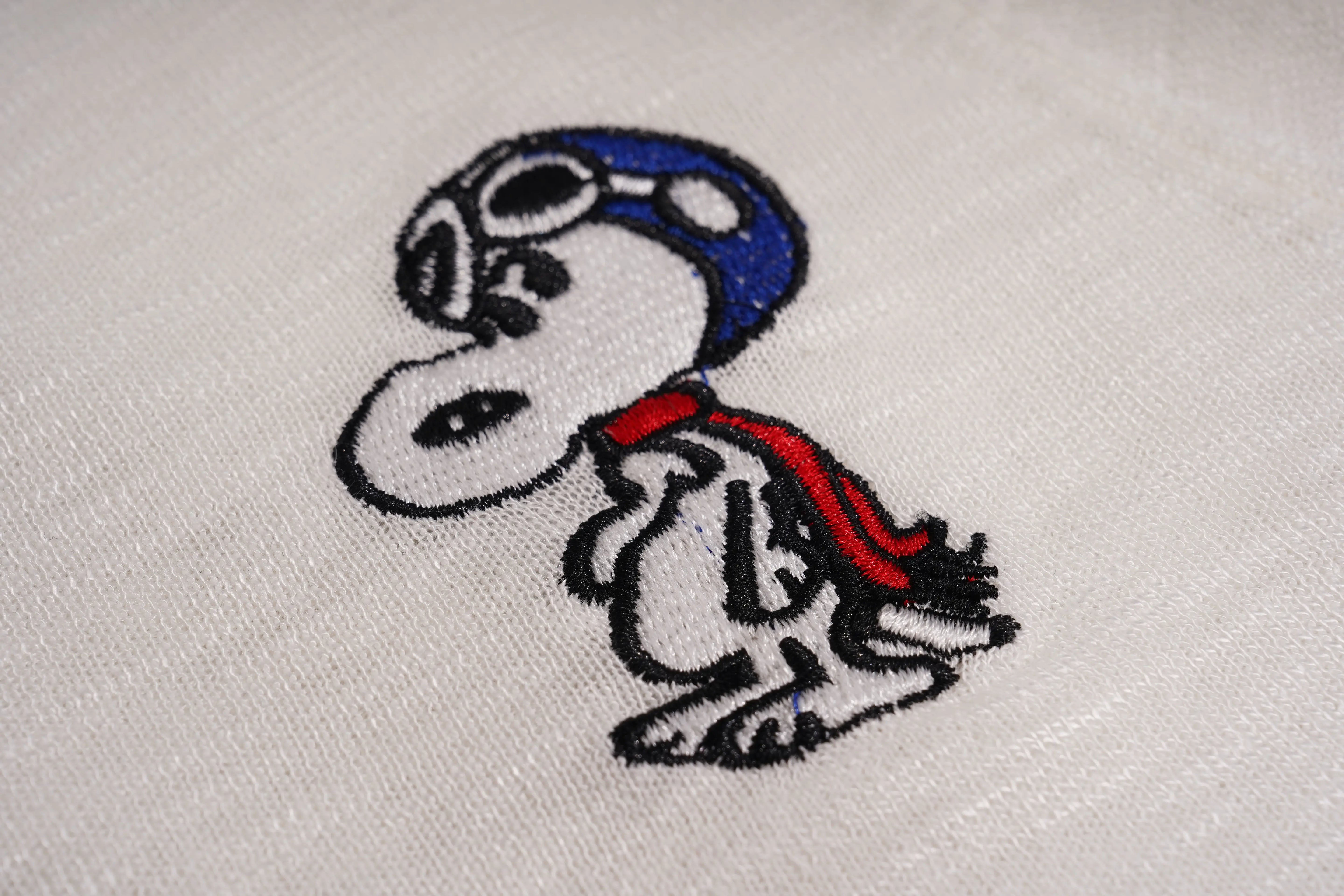 Embroidered design of a cartoon character on fabric, TCH White Rhinestone Bow Knit Cardigan