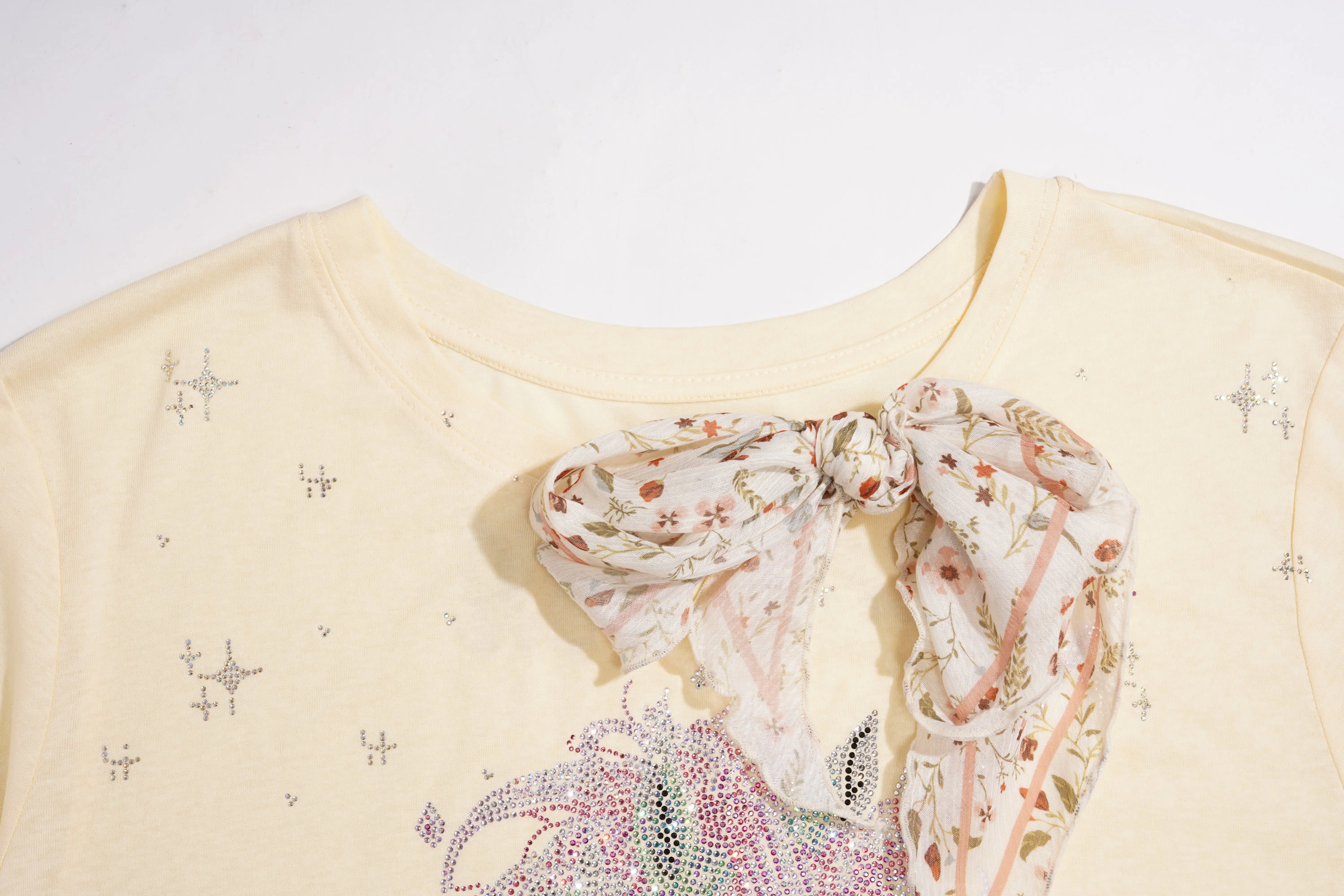 Beige top with floral scarf tied around the neck on a white background, TCH Yellow Rhinestone Realistic Unicorn Graphic Bow Detail T-Shirt