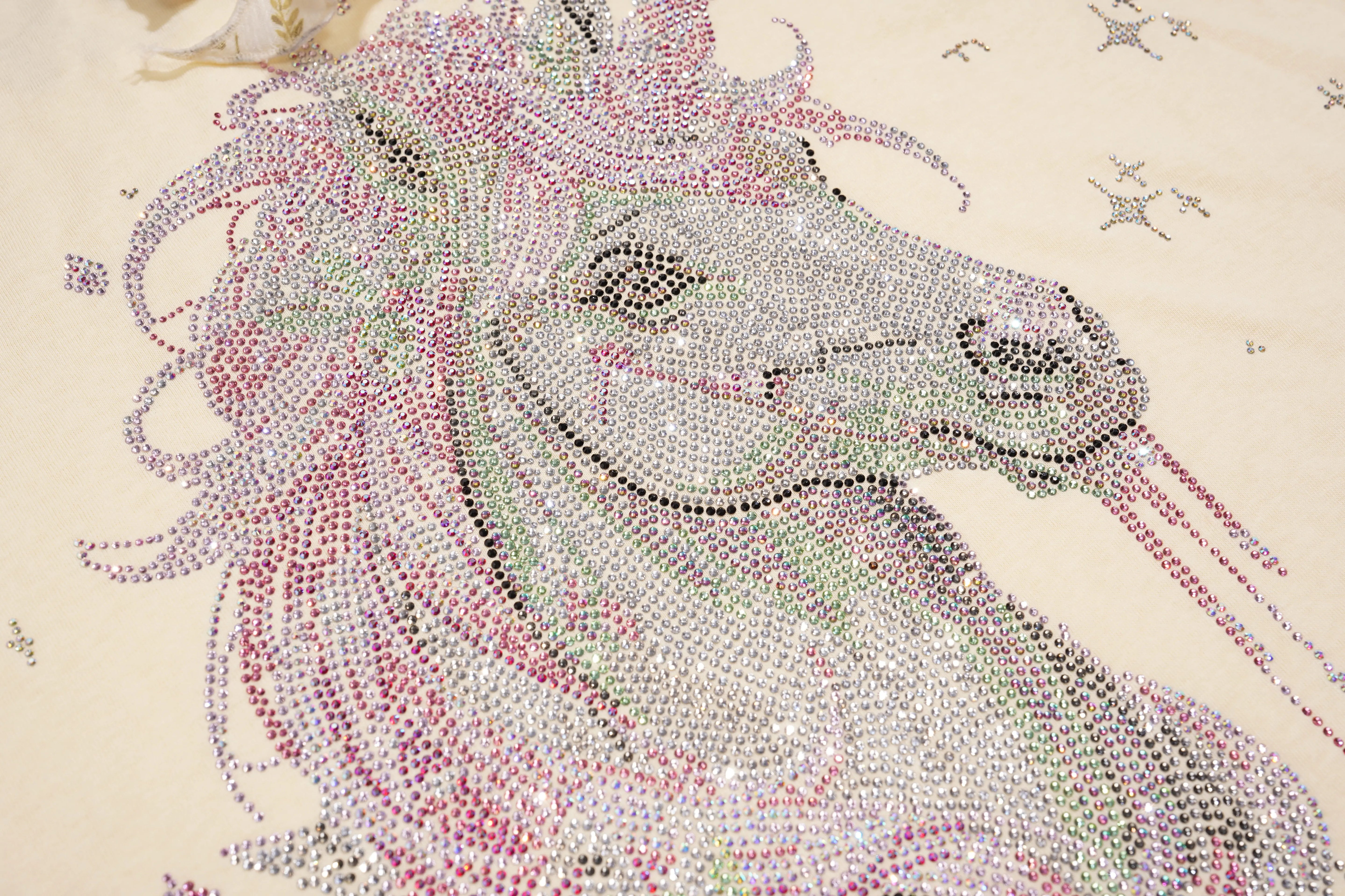 Unicorn head made of colorful rhinestones on a beige background, TCH Yellow Rhinestone Realistic Unicorn Graphic Bow Detail T-Shirt