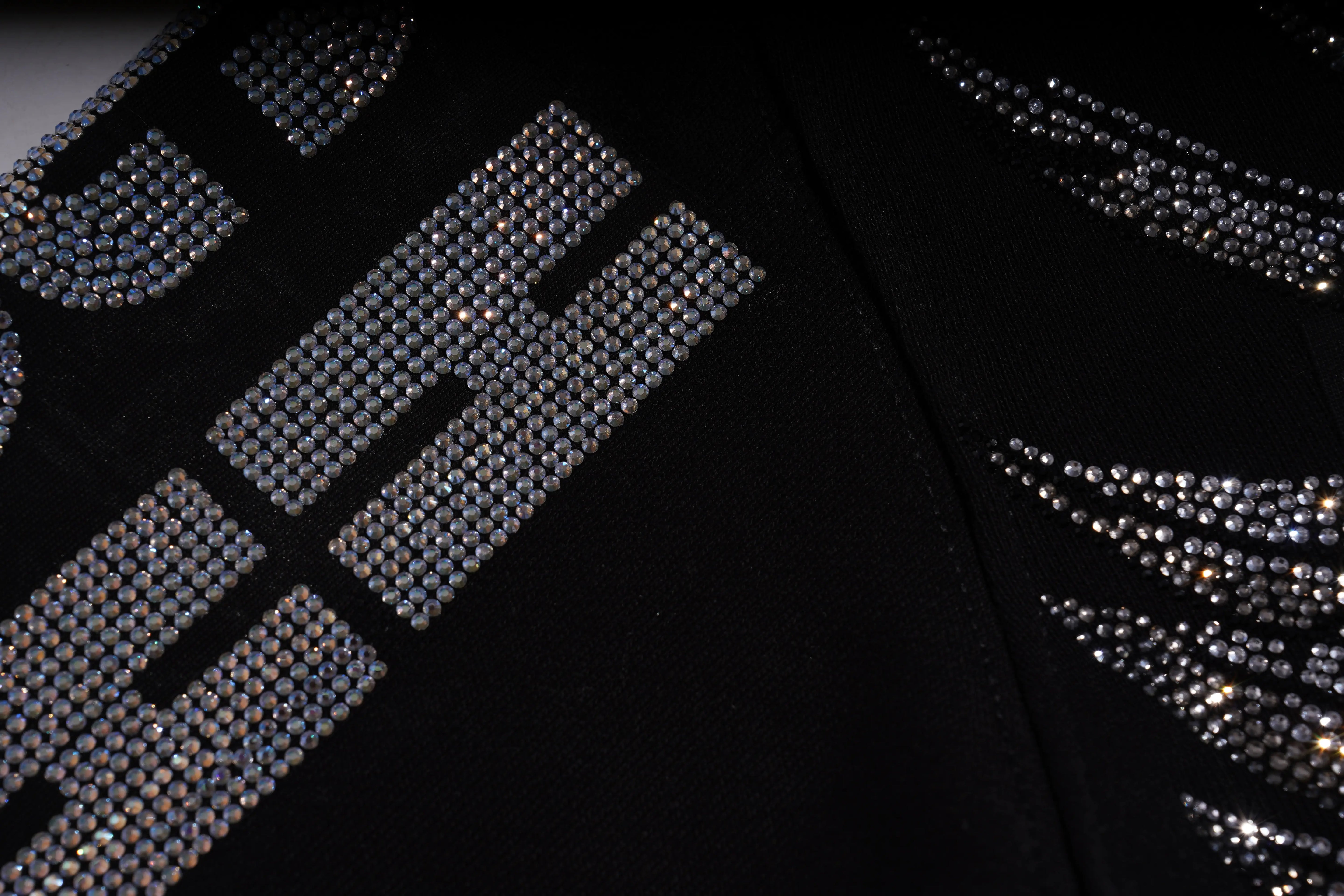 Black fabric with silver rhinestone embellishments on a black background, TCH 1976 Rhinestone Wings Sweatshirt