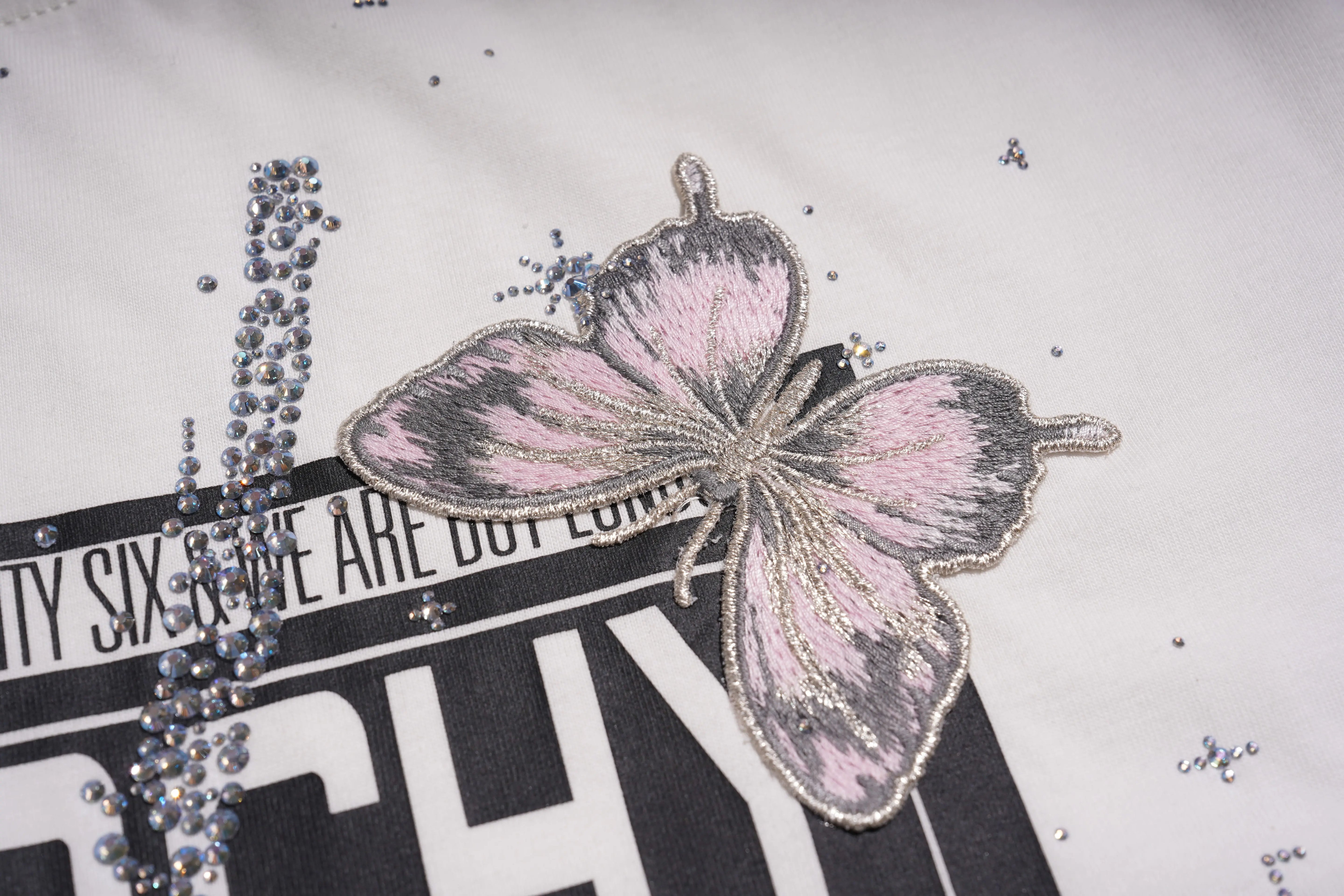 Butterfly design with rhinestones on a textured surface, TCH Anarchy Graphic Rhinestone T-Shirt