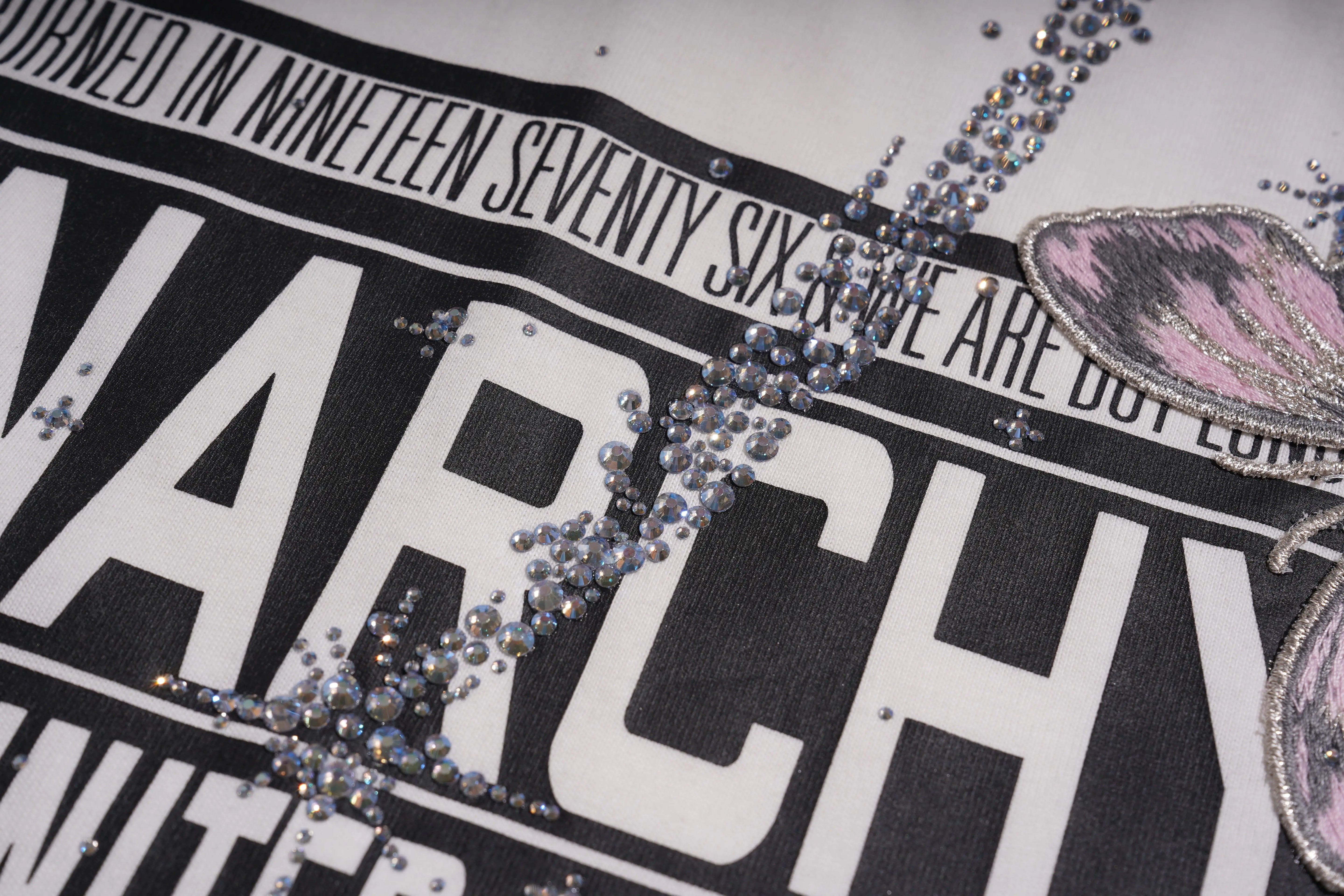 Close-up of a black and white graphic with 'WARCHY' text and decorative elements. TCH Anarchy Graphic Rhinestone T-Shirt