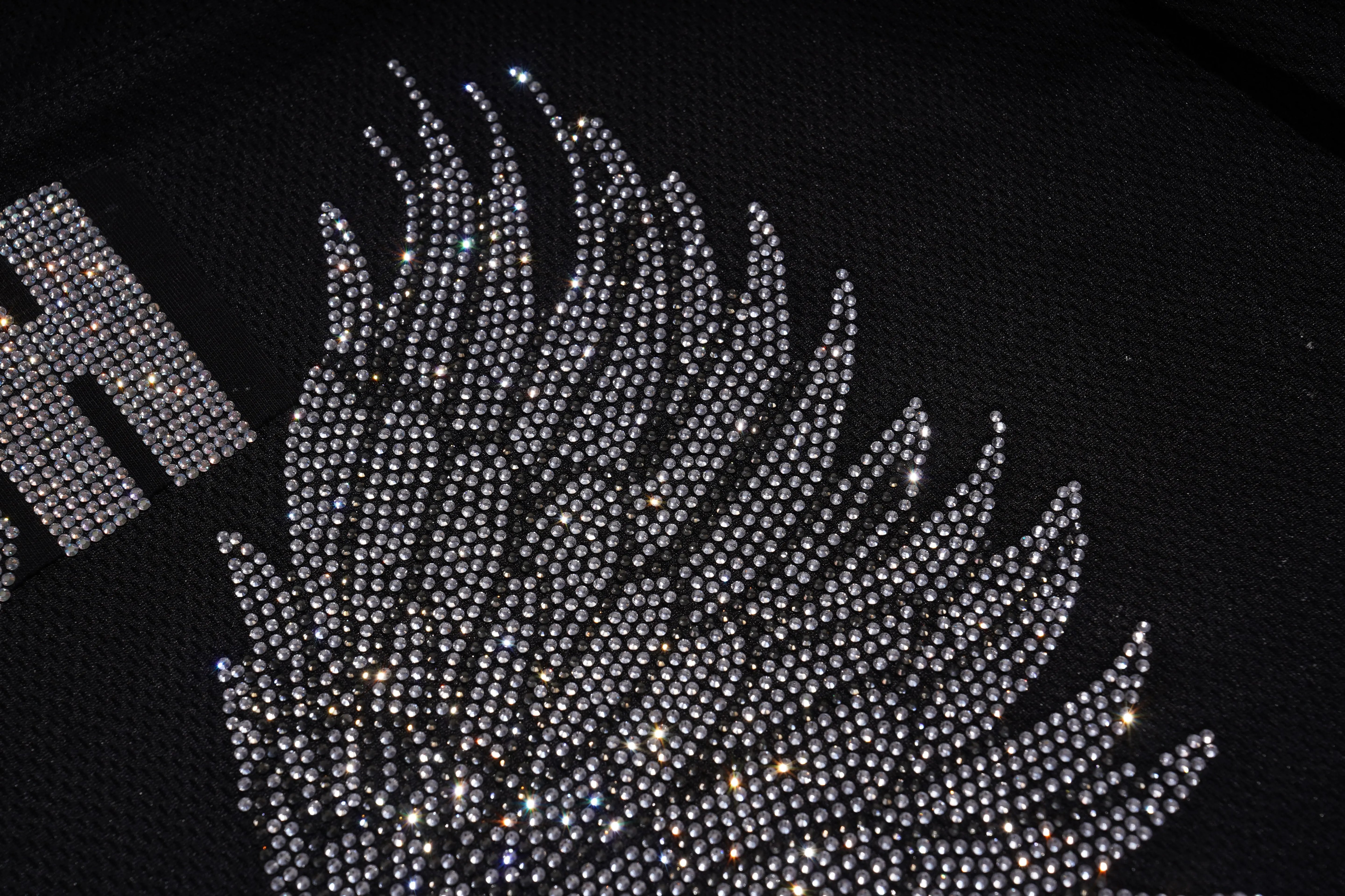 Close-up of a rhinestone design on a black background, TCH Angel Wings Rhinestone V-Neck Tee