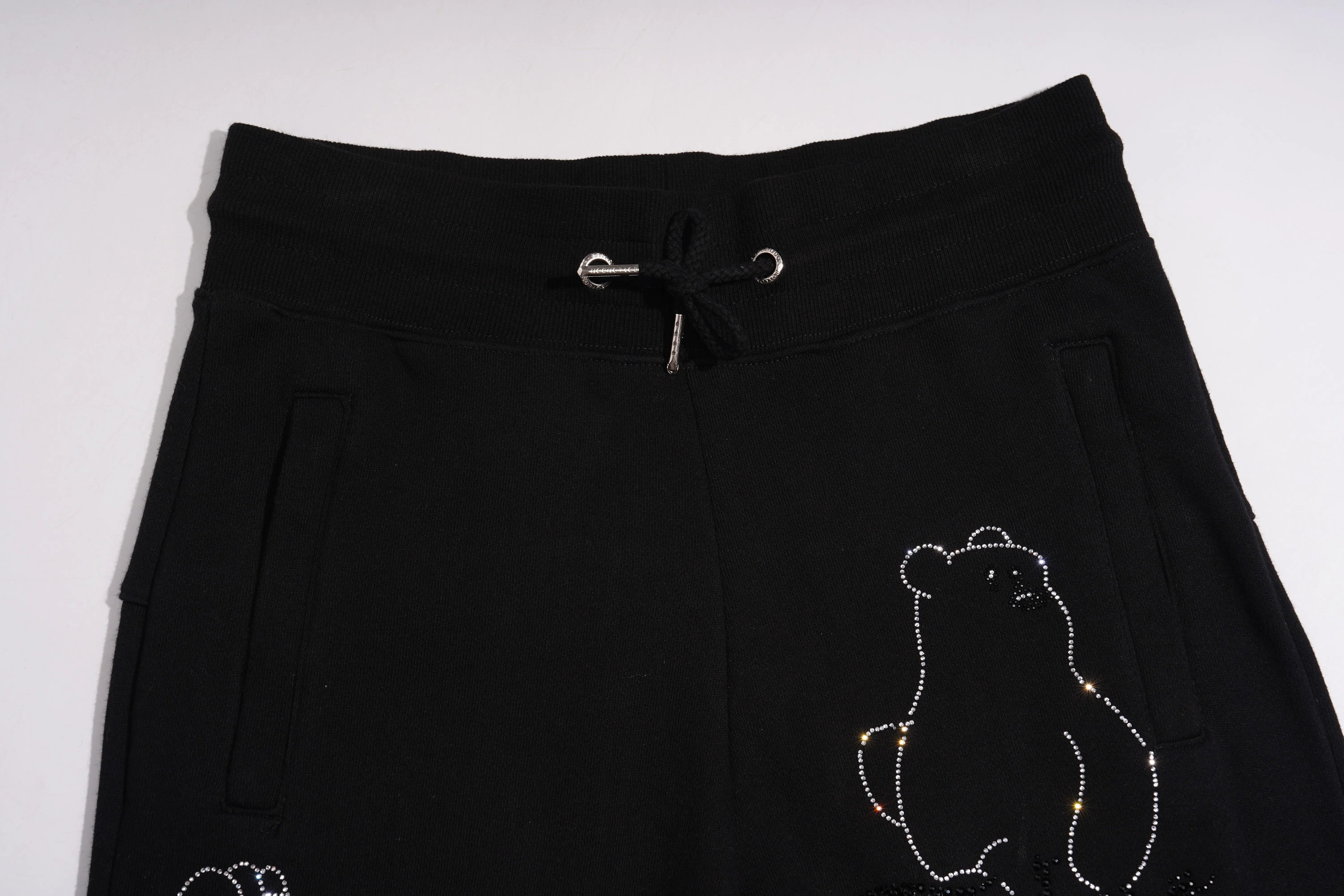 Black pants with a bear design on a white background, TCH Bear Sketch Rhinestone Jogger Pants