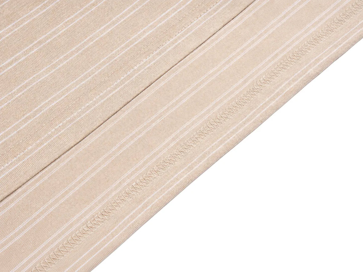 A close-up of a beige fabric with thin white vertical stripes and a decorative stitched border, shown diagonally against a white background. TCH Beige Floral Embroidered Long Sleeve Polo Shirt