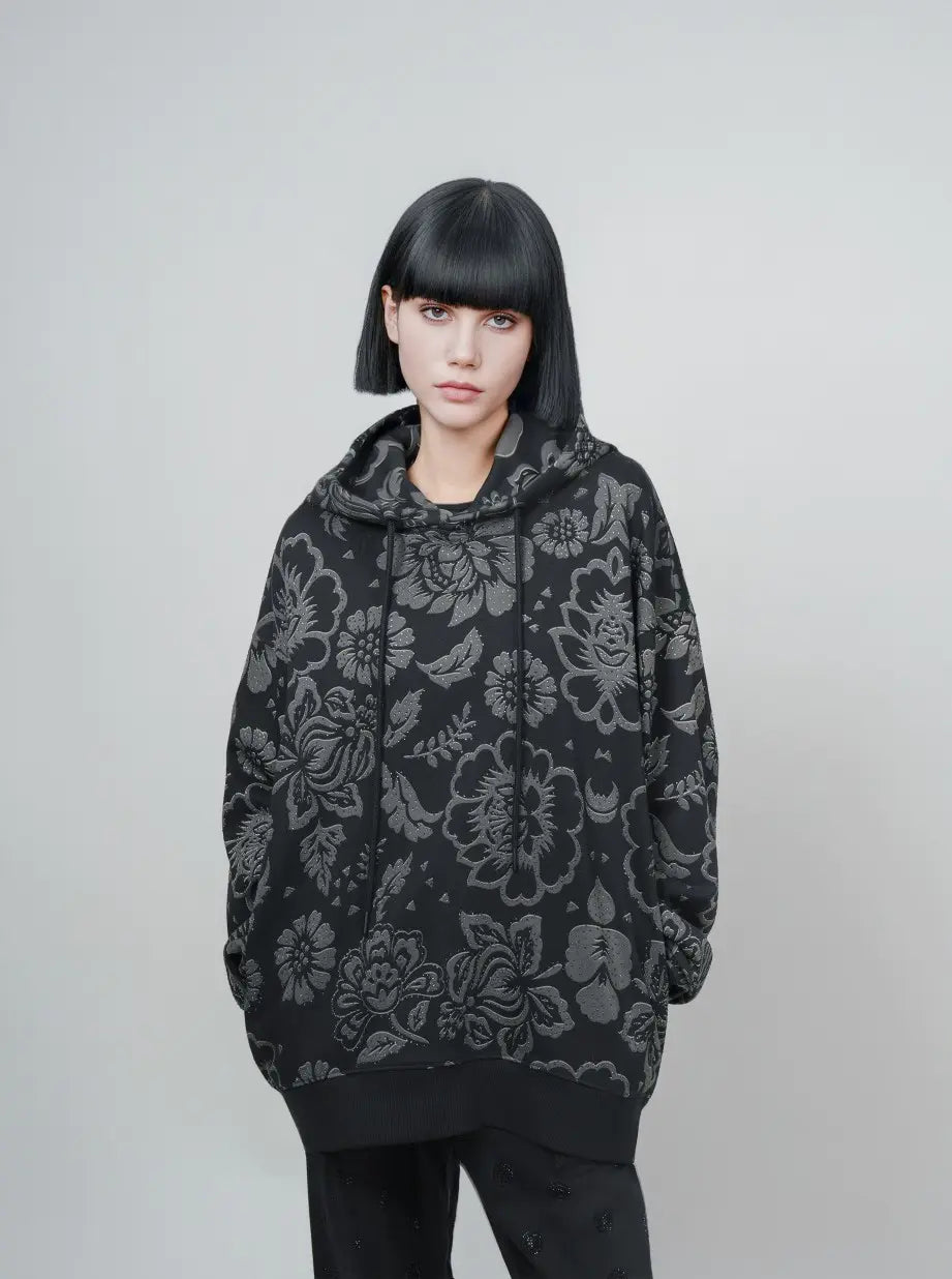 TCH Black Floral Embossed Graphic Hoodie TCH black floral hoodie Black floral graphic hoodie Textured floral hoodie Black botanical print hoodie Charcoal floral pullover Gothic floral streetwear hoodie Black patterned hoodie All-over floral print sweatshirt Dark aesthetic streetwear hoodie Graphic hooded sweatshirt