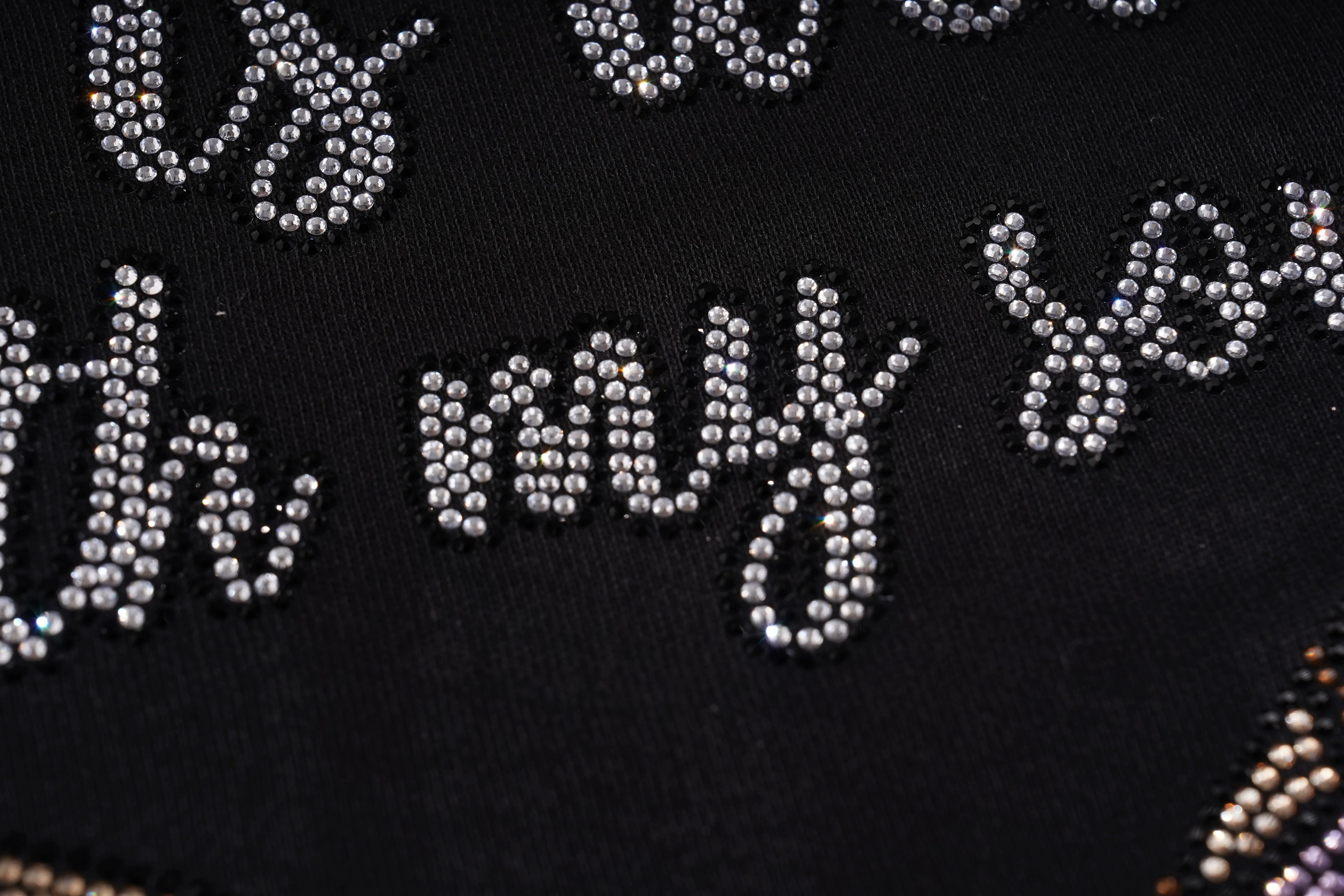 Text with rhinestone embellishments on a black background, TCH Black Rhinestone Bow Cropped Sweatshirt