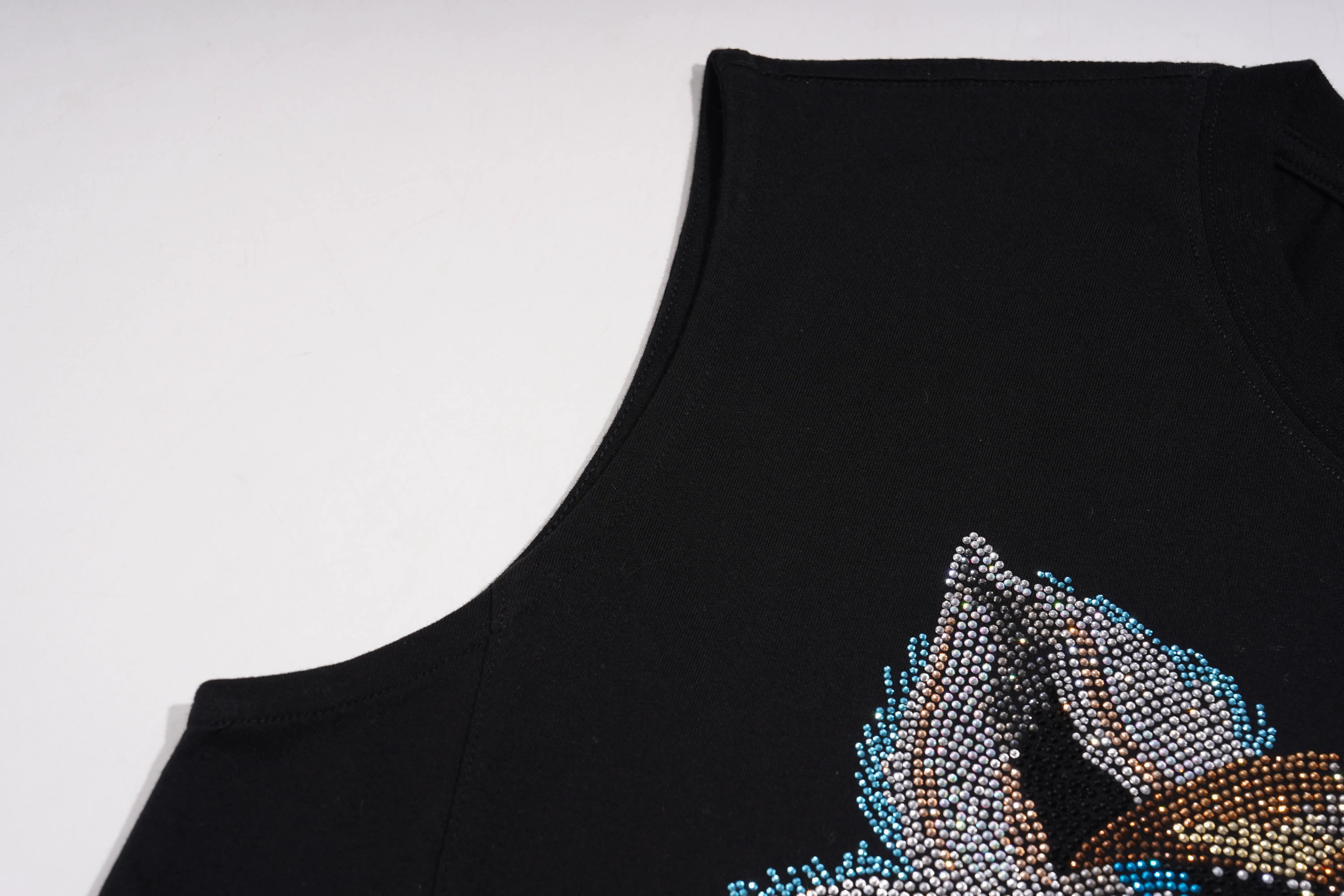 Black sleeveless top with a decorative design on a white background, TCH Black Rhinestone Cartoon Pig Sleeveless Top