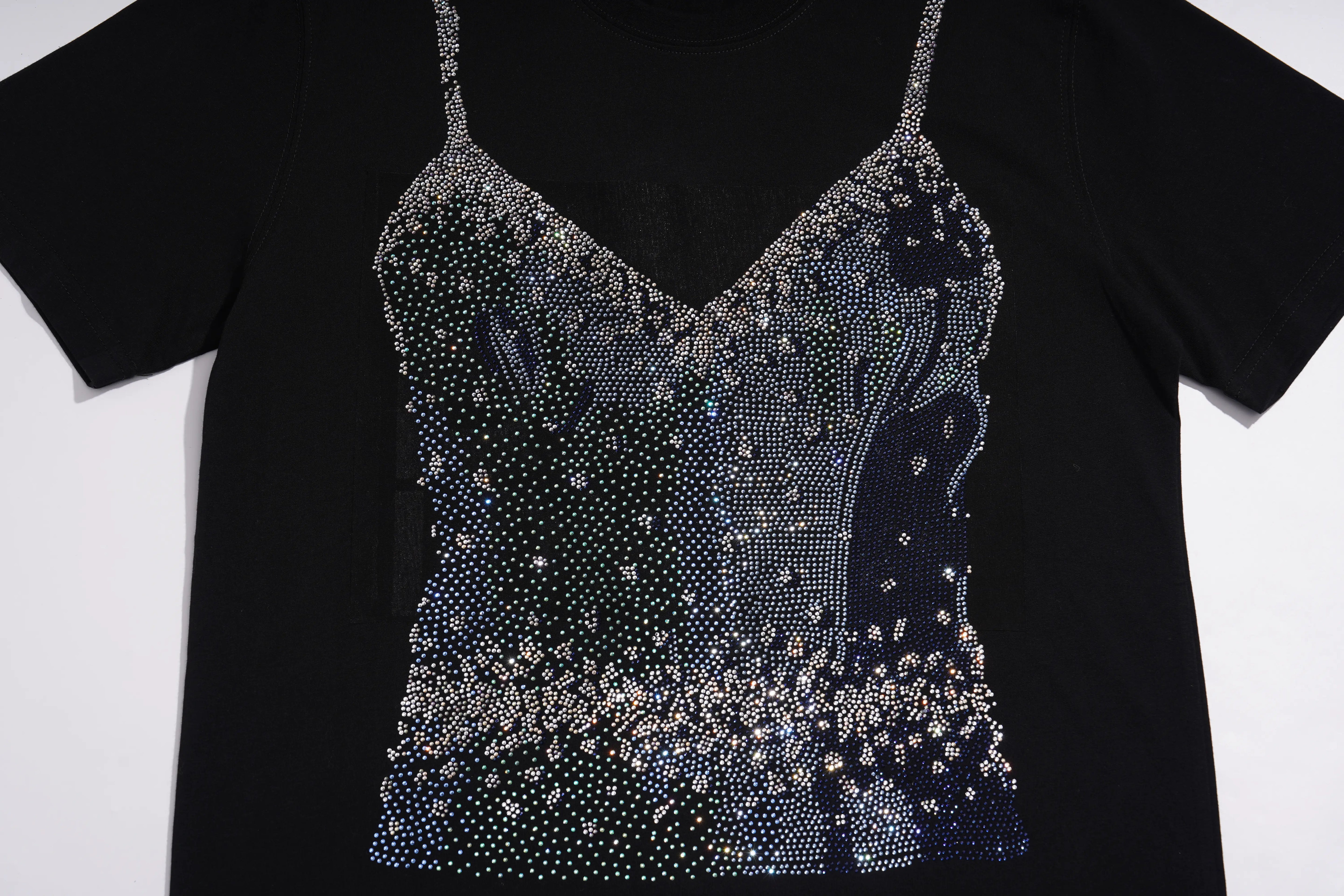 A black short-sleeve t-shirt featuring a decorative rhinestone-embellished camisole-style bodice overlay in silver and blue tones, displayed against a plain white background. TCH Black Rhinestone Corset Graphic T-Shirt