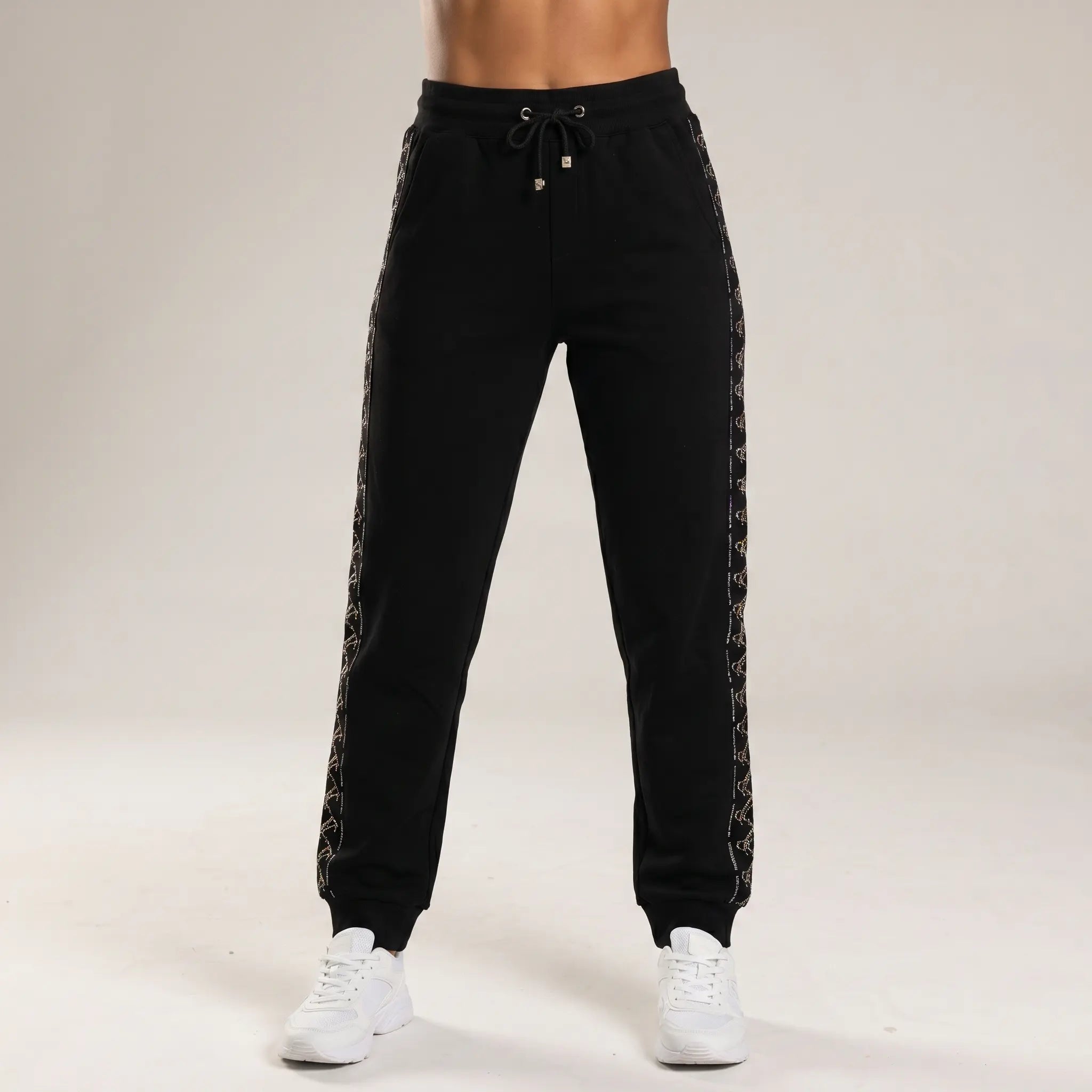 Black jogger pants worn by a person on a plain background, TCH Black Rhinestone Side Stripe Jogger Pants