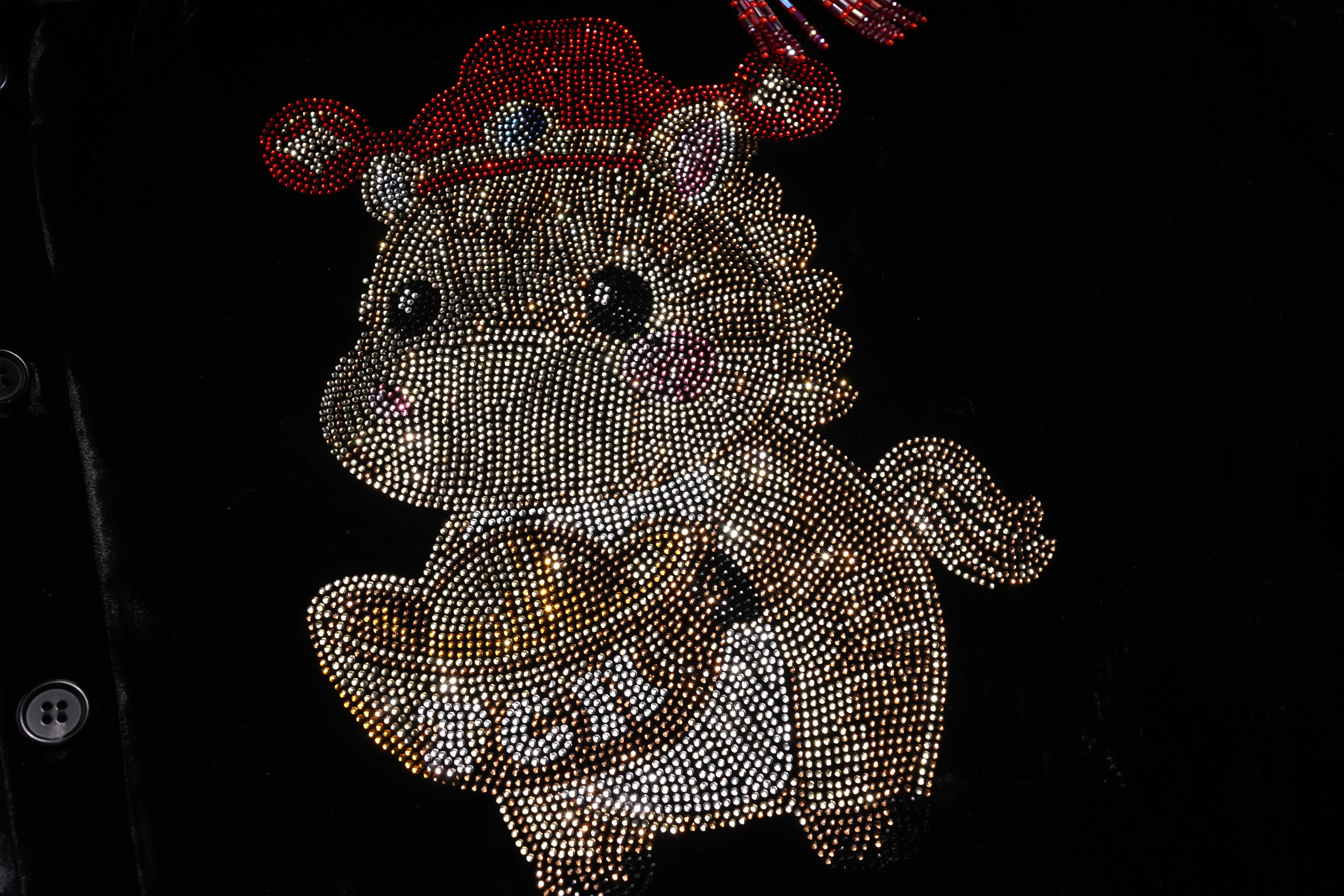 Decorative animal figure with a red hat on a black background, TCH Black Vest Rhinestone Lucky Horse & Red Stitch Wooden Horse Design
