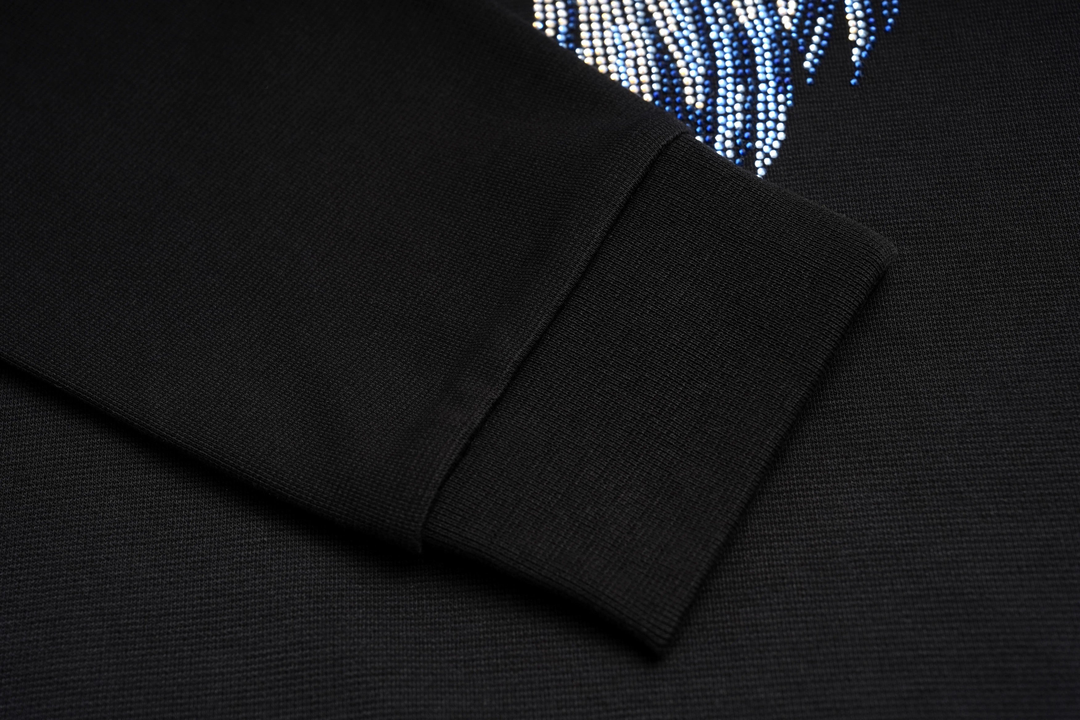 Black long-sleeve shirt with a decorative sleeve design on a dark background, TCH Blue Angel Wings Rhinestone Sweatshirt