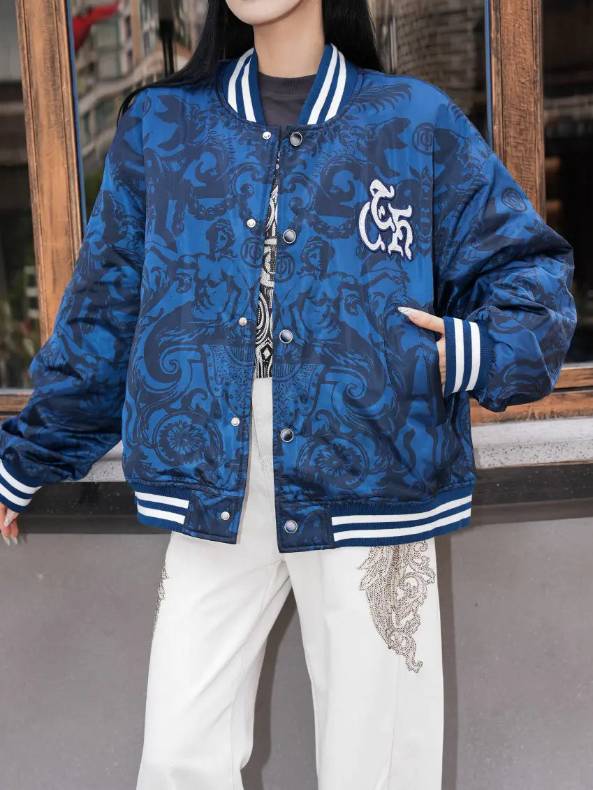 TCH Blue Baroque Pattern Embroidered Varsity Jacket TCH blue varsity jacket Blue baroque pattern jacket Gothic graphic varsity jacket Navy blue streetwear jacket Baroque print bomber jacket Embroidered varsity jacket Gothic lettering jacket Blue snap-button jacket Ornamental print streetwear jacket TCH graphic bomber jacket
