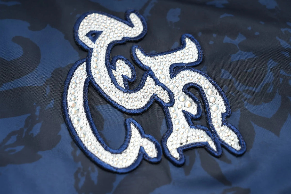 TCH Blue Baroque Pattern Embroidered Varsity Jacket TCH blue varsity jacket Blue baroque pattern jacket Gothic graphic varsity jacket Navy blue streetwear jacket Baroque print bomber jacket Embroidered varsity jacket Gothic lettering jacket Blue snap-button jacket Ornamental print streetwear jacket TCH graphic bomber jacket