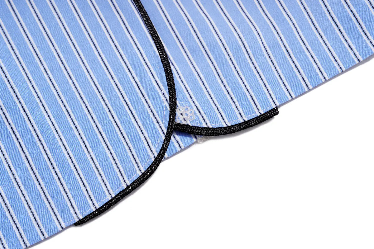 Close-up of a light blue and white striped fabric item with a black braided trim, shown on a white background. TCH Blue Pinstripe Embroidered Pocket Shirt
