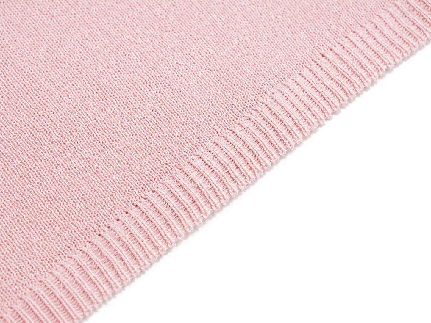 A close-up of a light pink knit fabric with a ribbed border, shown against a plain white background. TCH Blue Rhinestone Angel Wings Cropped Hoodie