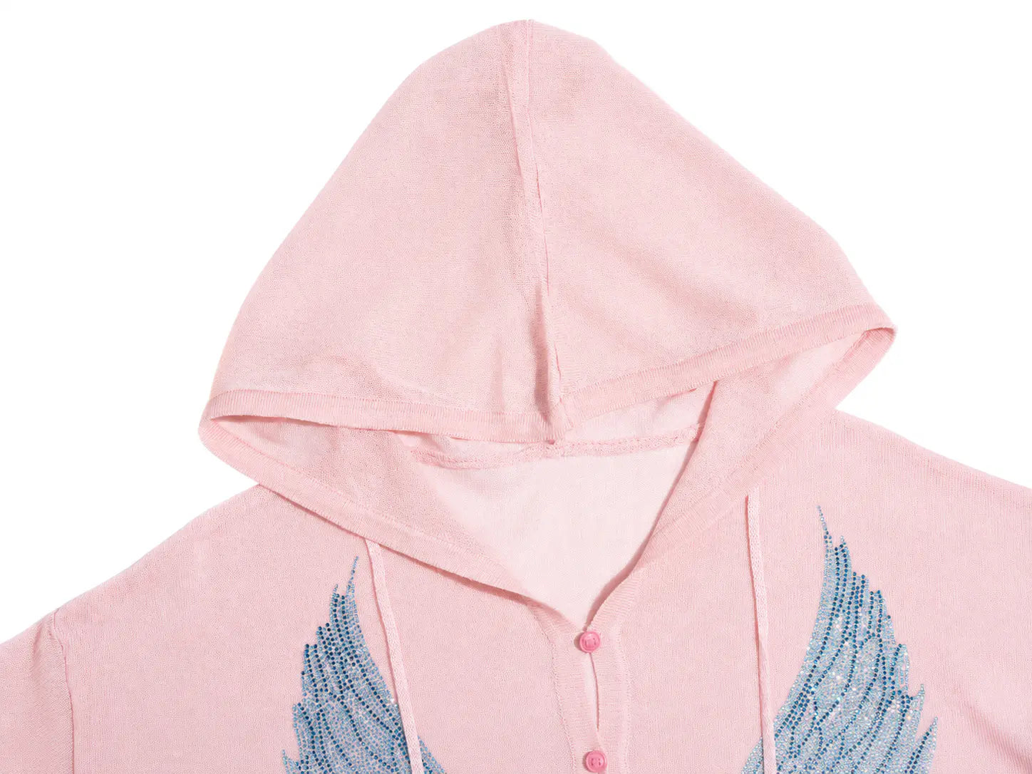 A close-up of a light pink hooded sweatshirt featuring blue embroidered angel wings on the front chest and a buttoned placket. TCH Blue Rhinestone Angel Wings Cropped Hoodie