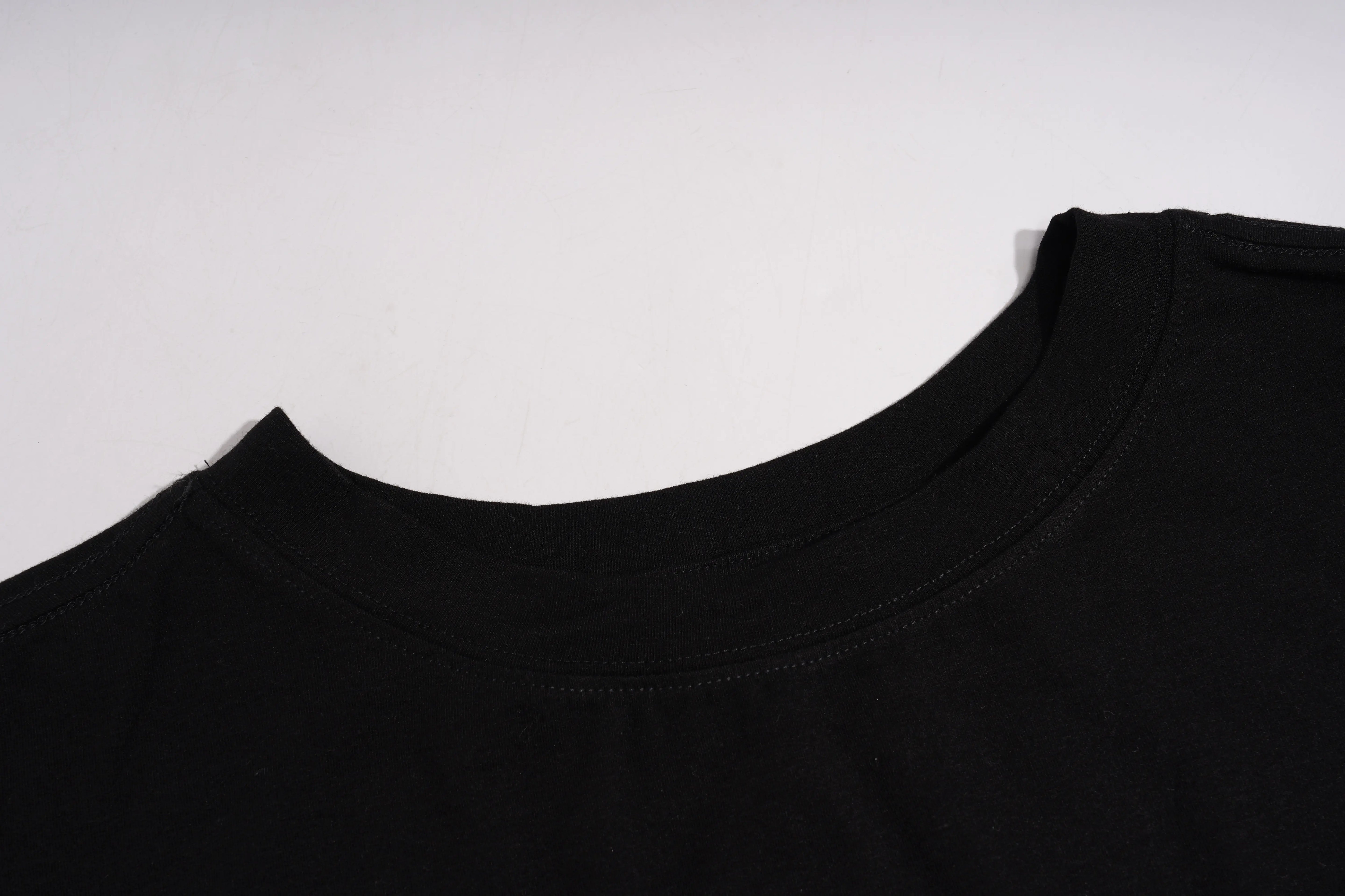 Close-up of a black t-shirt collar on a white background, TCH Butterfly Rhinestone Oversized T-Shirt
