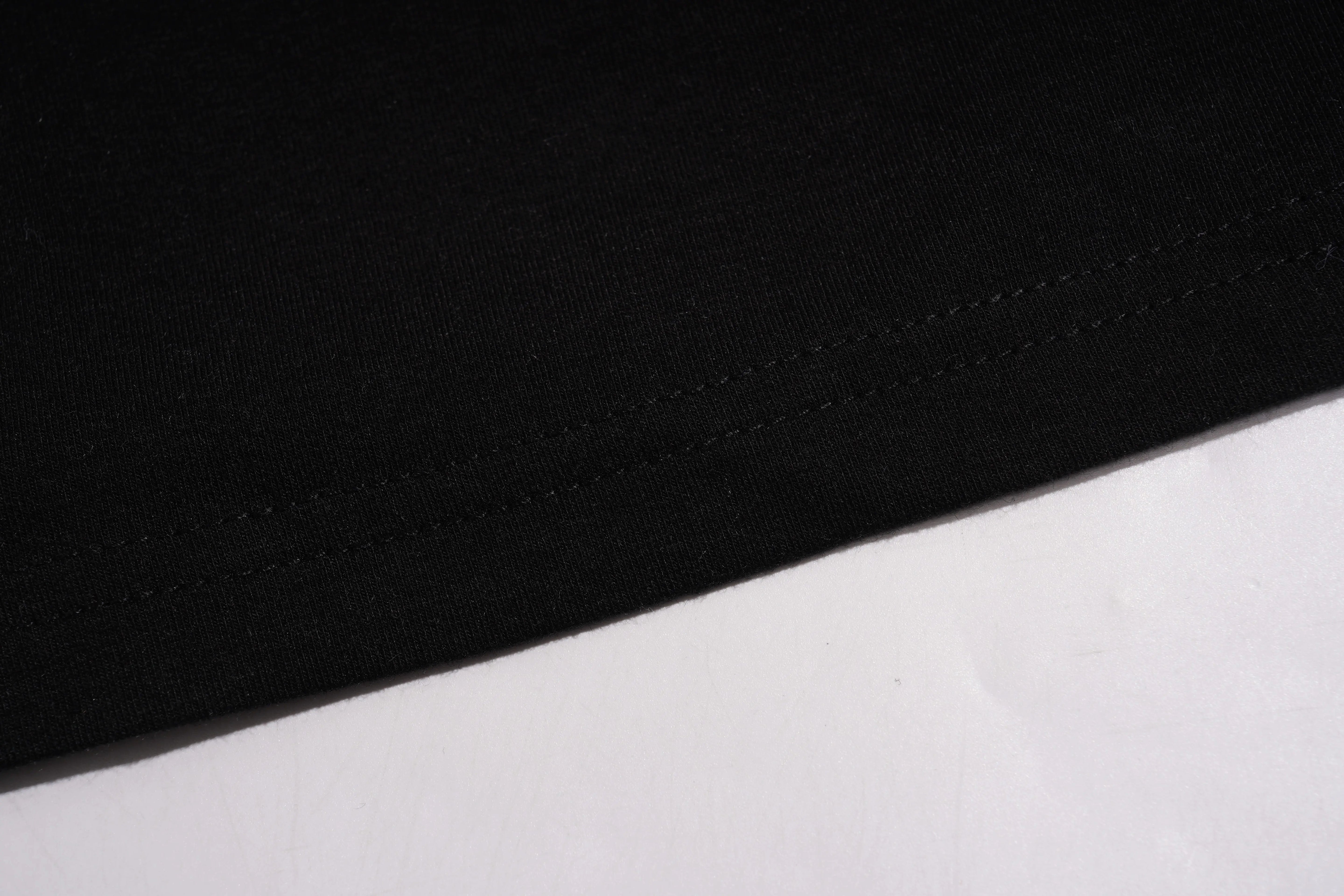 Close-up of black and white fabric texture, TCH Butterfly Rhinestone Oversized T-Shirt
