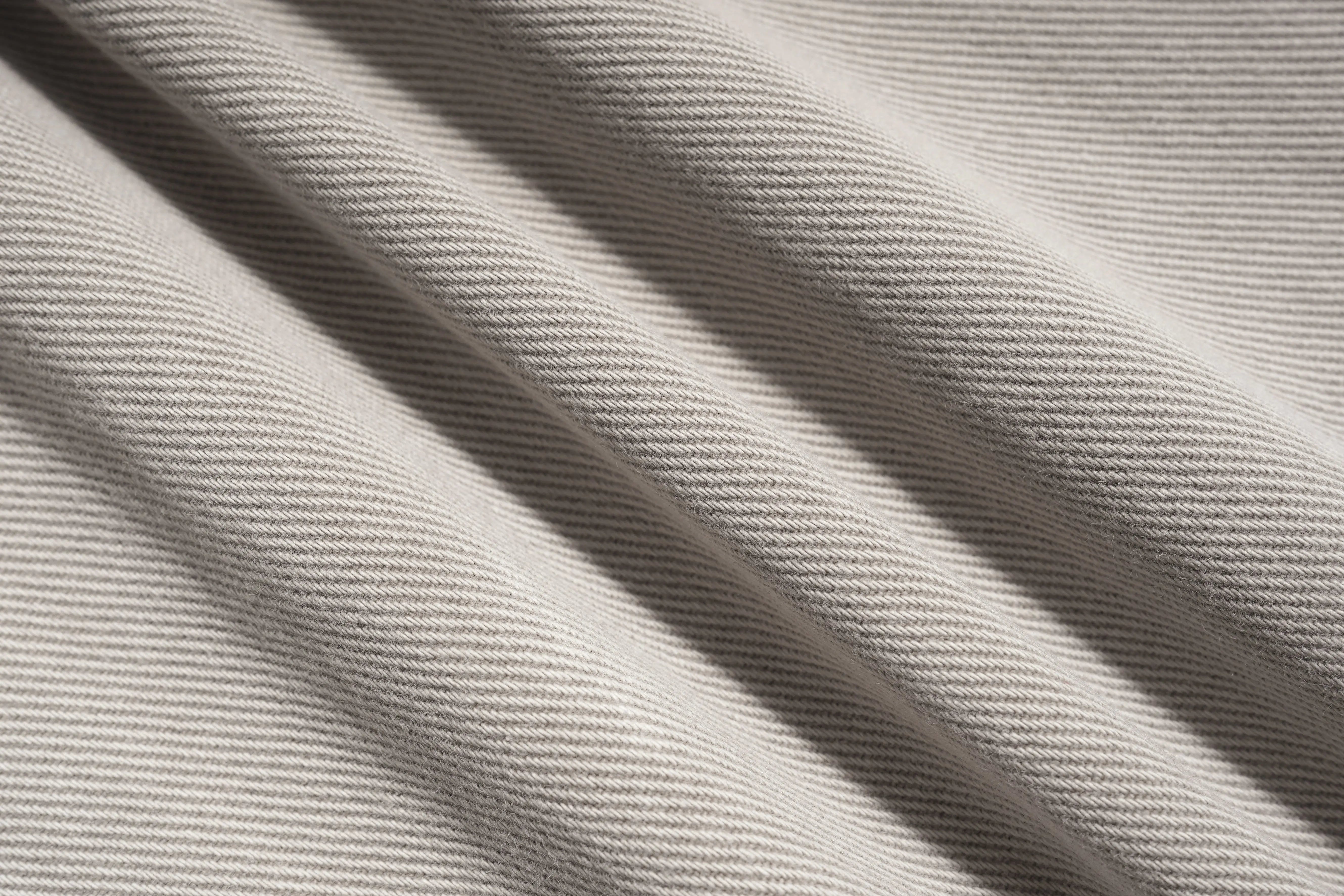 Close-up of beige fabric with visible texture, TCH Celestial Firework Rhinestone Wide-Leg Pants