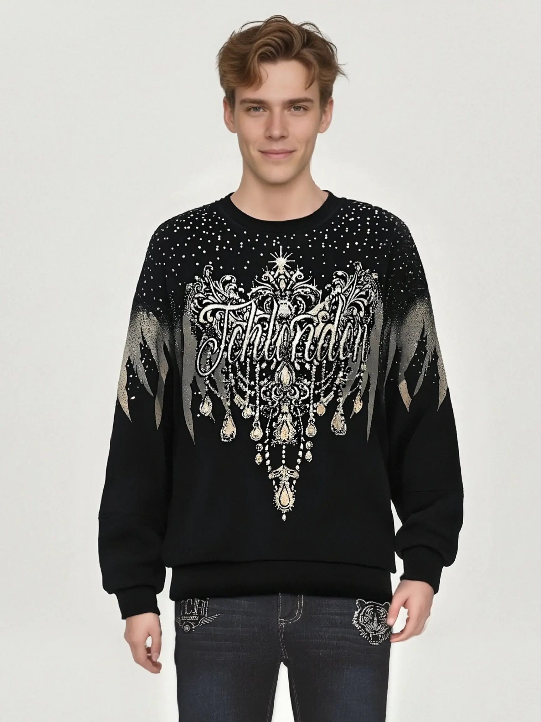Man wearing a black sweater with decorative elements and text on a plain background, TCH Celestial Wing Graphic Crewneck Sweatshirt