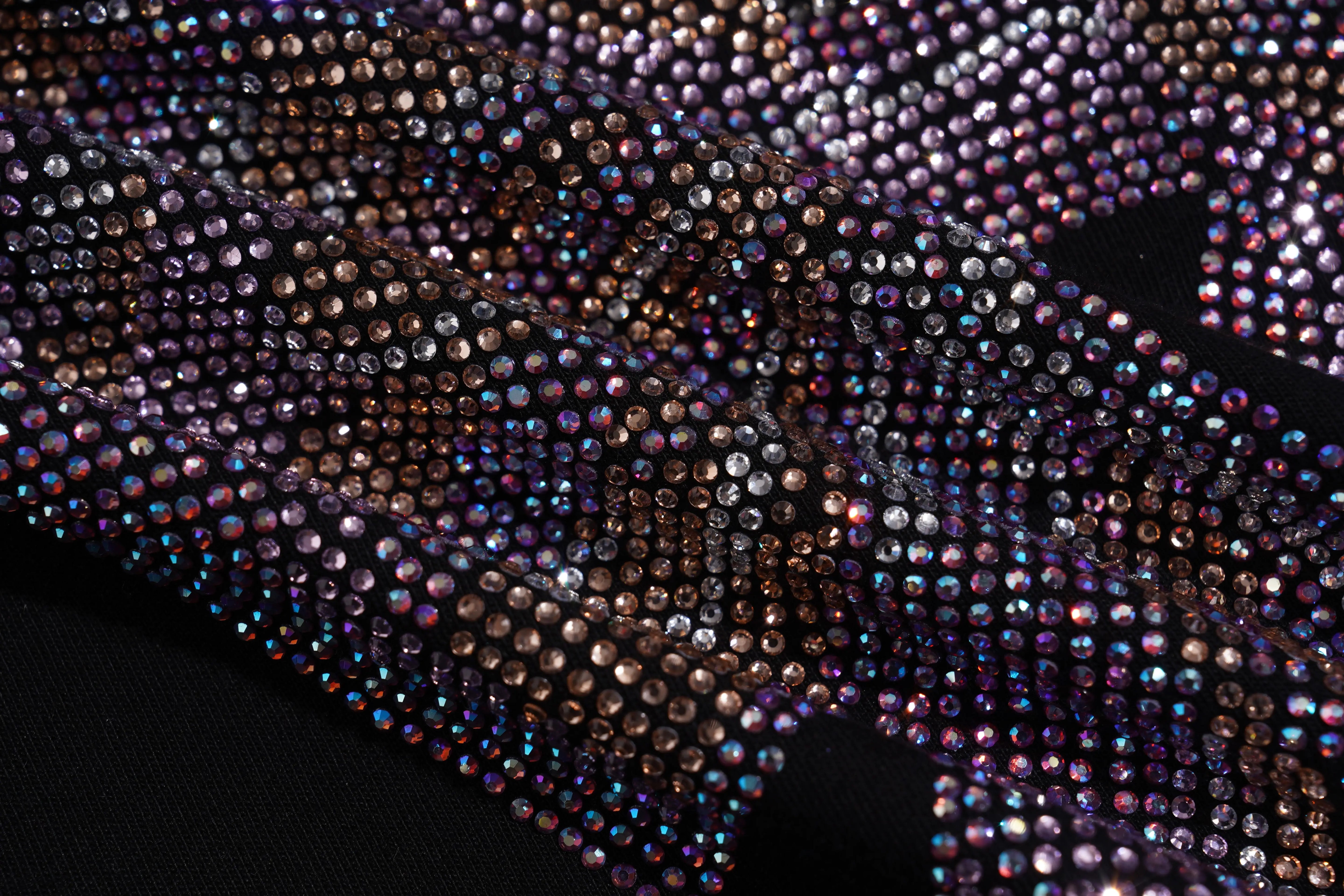 Close-up of a fabric with multicolored rhinestones on a black background, TCH Chihuahua Bow Rhinestone T-Shirt