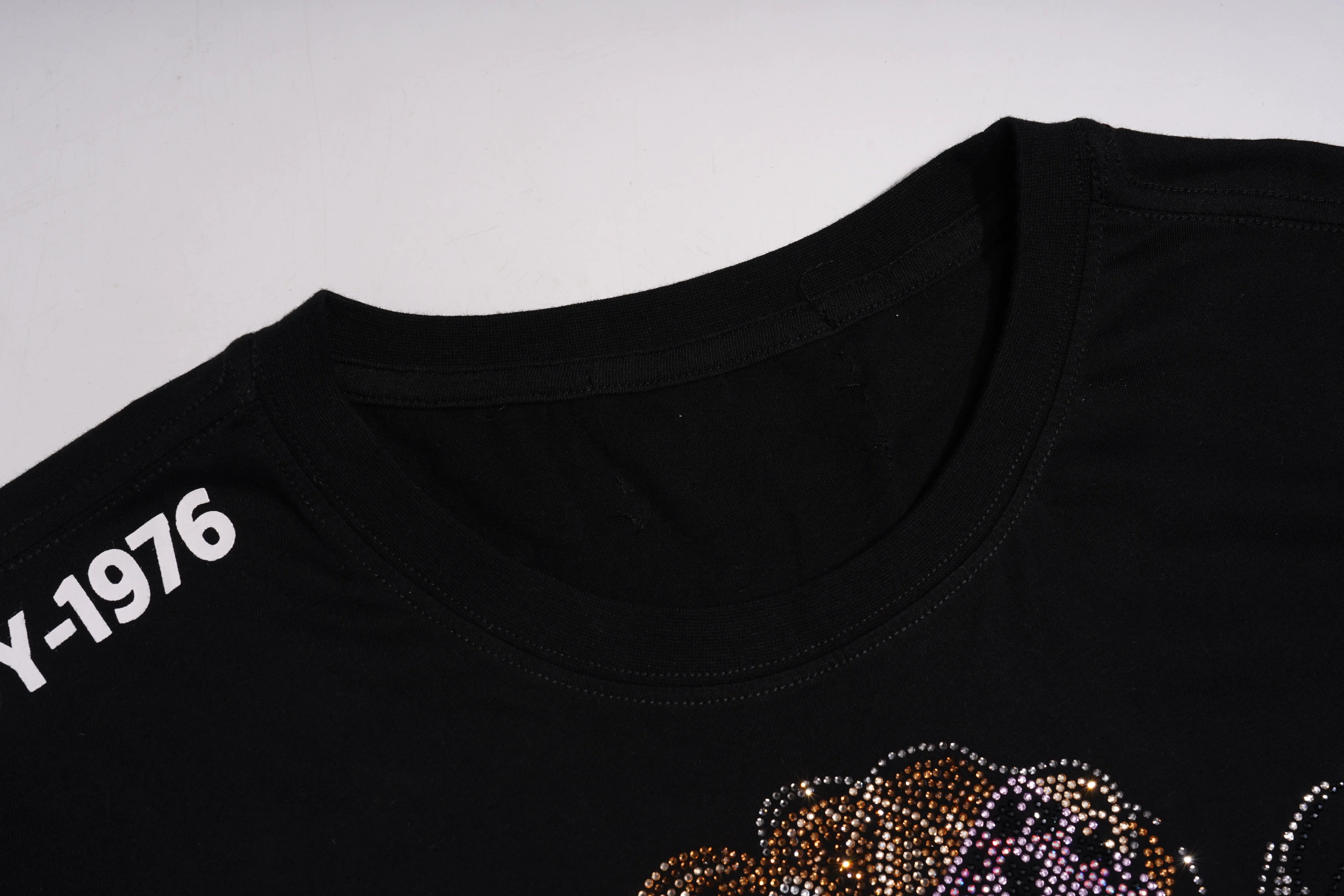 Black t-shirt with white text 'Y-1976' and decorative elements on a light gray background, TCH Chihuahua Bow Rhinestone T-Shirt