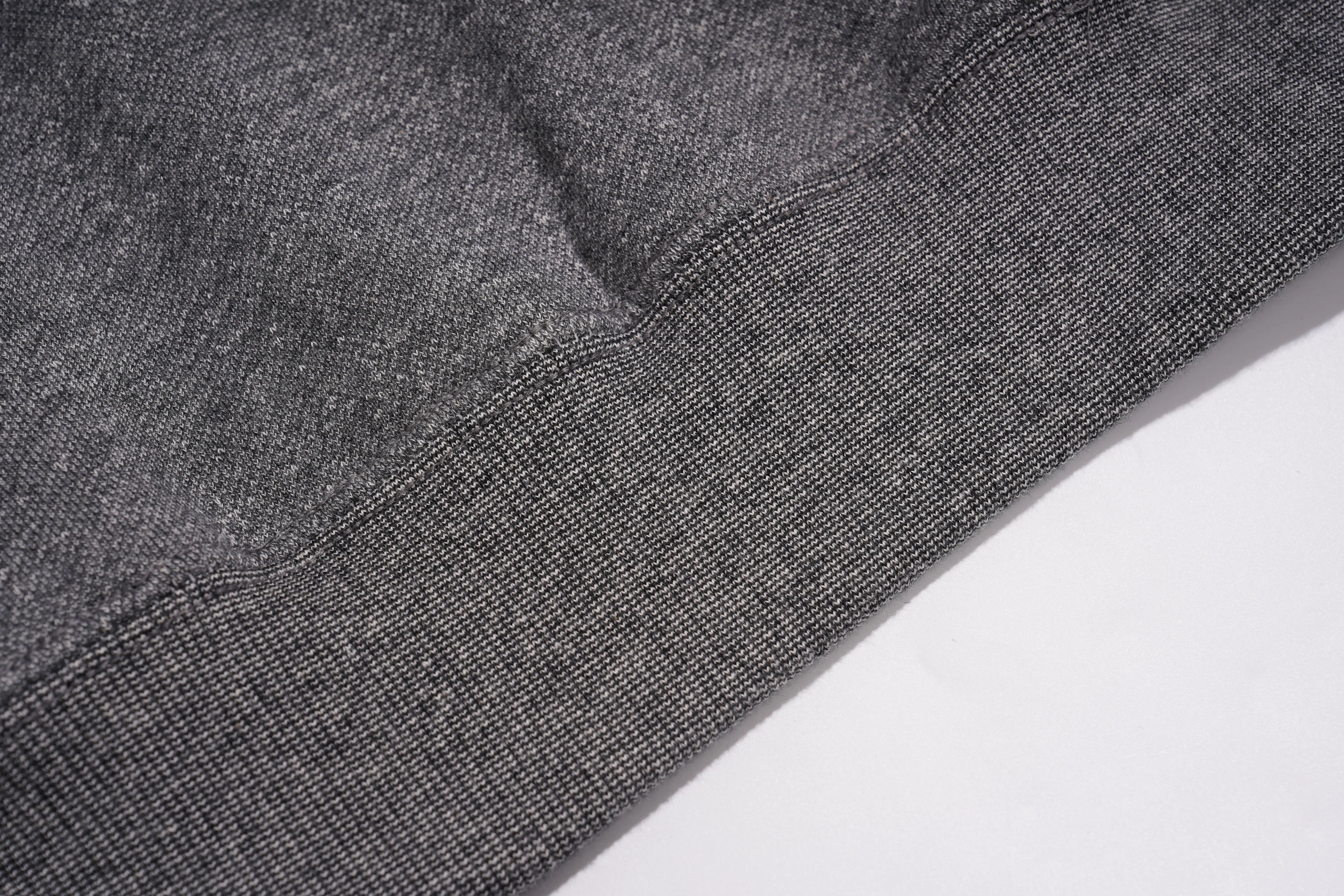 Close-up of a dark gray ribbed knit fabric, likely a sweatshirt cuff or sleeve hem, showing the texture and stitching against a white background. TCH Colorful Rhinestone Teddy Bear Crewneck Sweatshirt