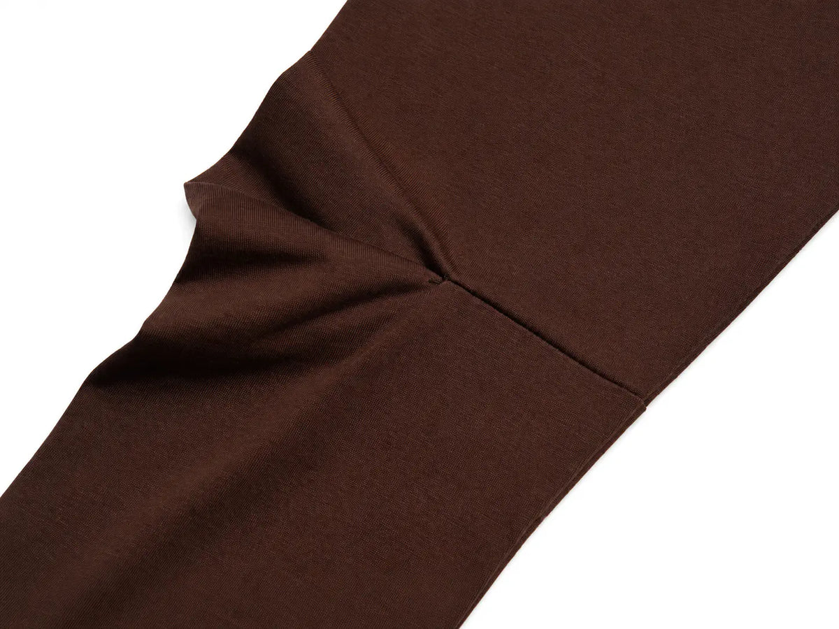 A close-up of dark brown knit fabric, likely a tights leg or sock, showing the texture and a seam detail against a plain white background. TCH Cute Lamb Pink Striped Raglan Long Sleeve Top