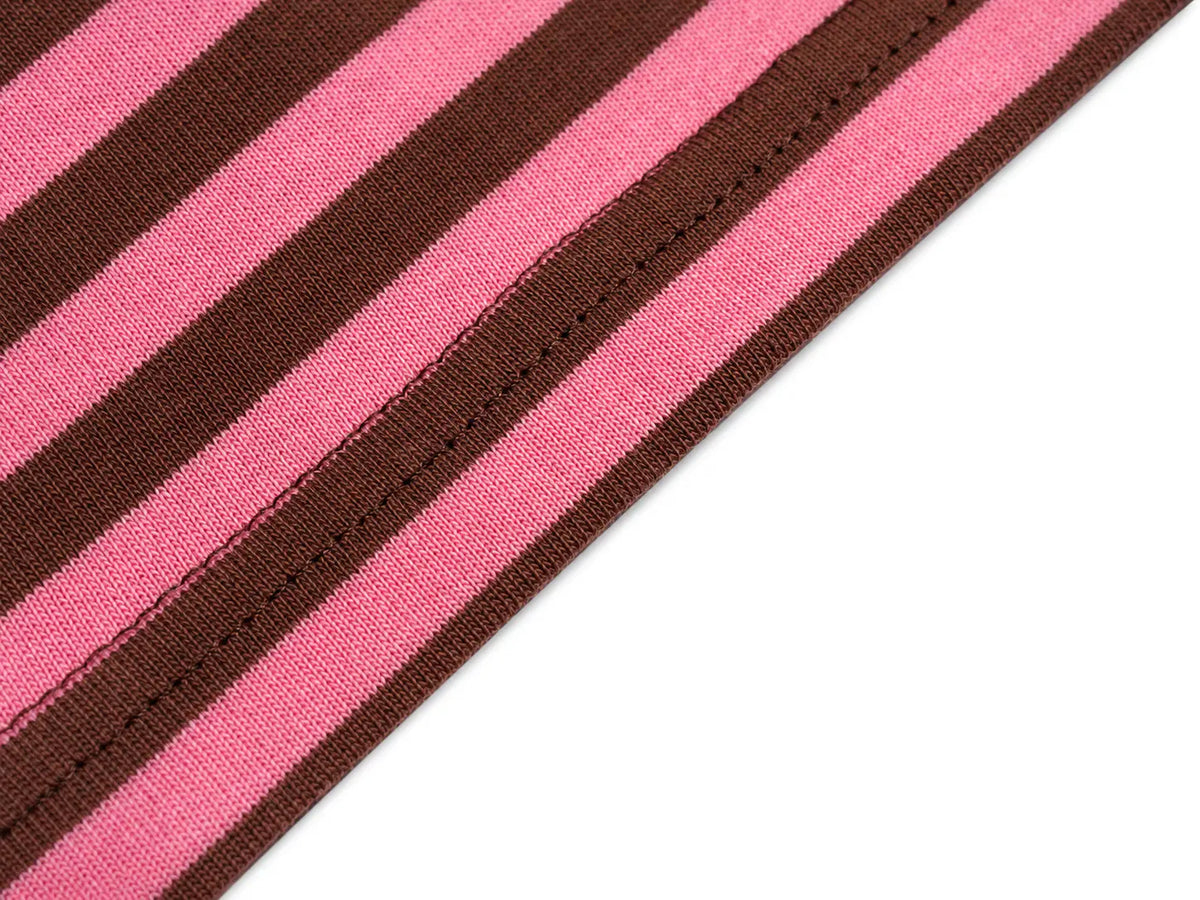 A close-up of a striped knit fabric with alternating pink and dark brown stripes, showing the texture and a stitched edge against a white background. TCH Cute Lamb Pink Striped Raglan Long Sleeve Top