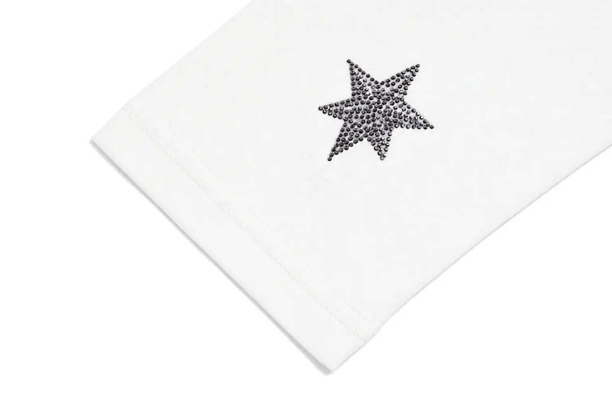 A close-up of a white fabric item, likely a sleeve or cuff, featuring a small black embroidered star embellished with tiny rhinestones, set against a clean white background. TCH Cute Rhinestone Cat Graphic Pink Long Sleeve T-Shirt