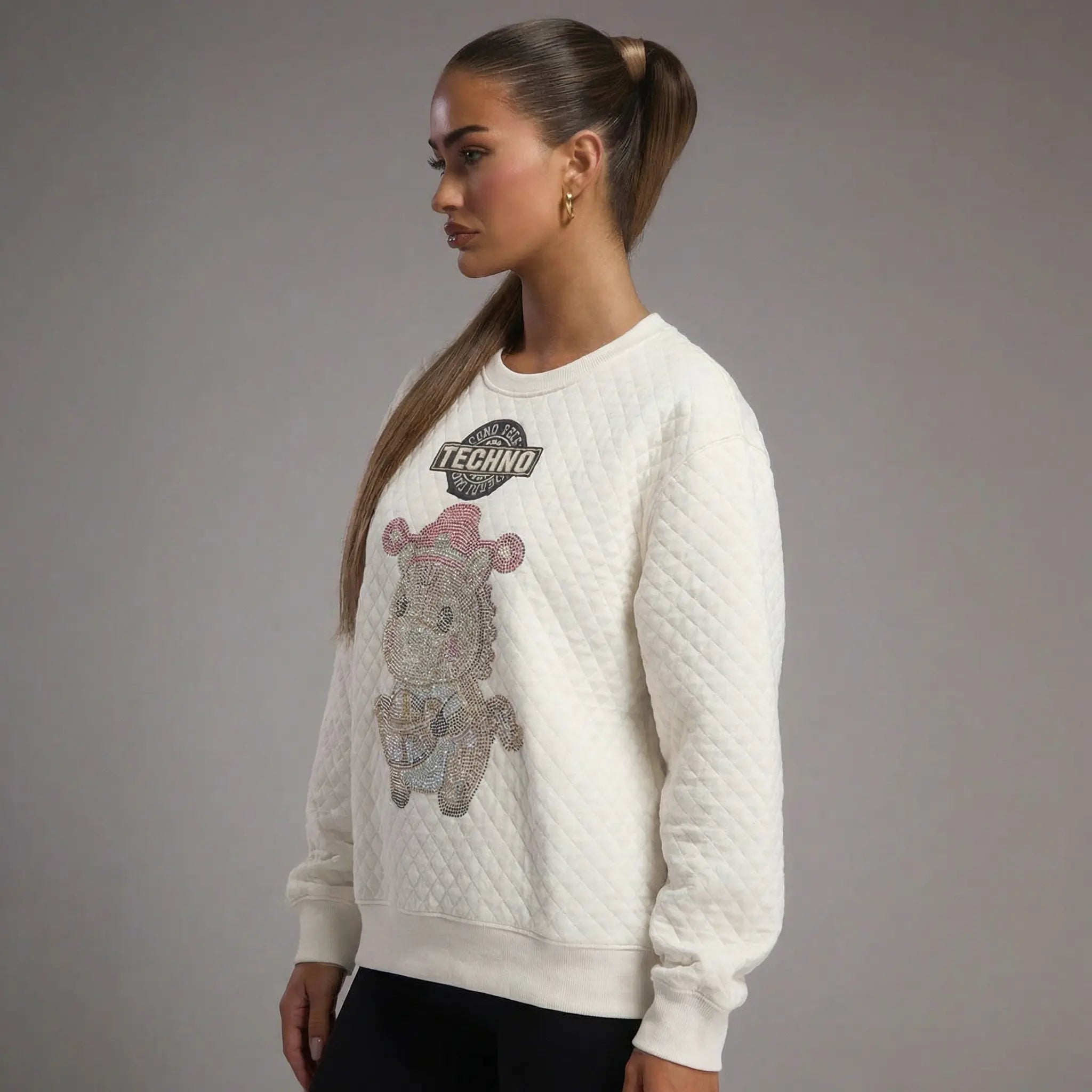 Woman wearing a white sweater with a graphic design on a gray background, TCH Cute Rhinestone Fortune Pony Sweatshirt