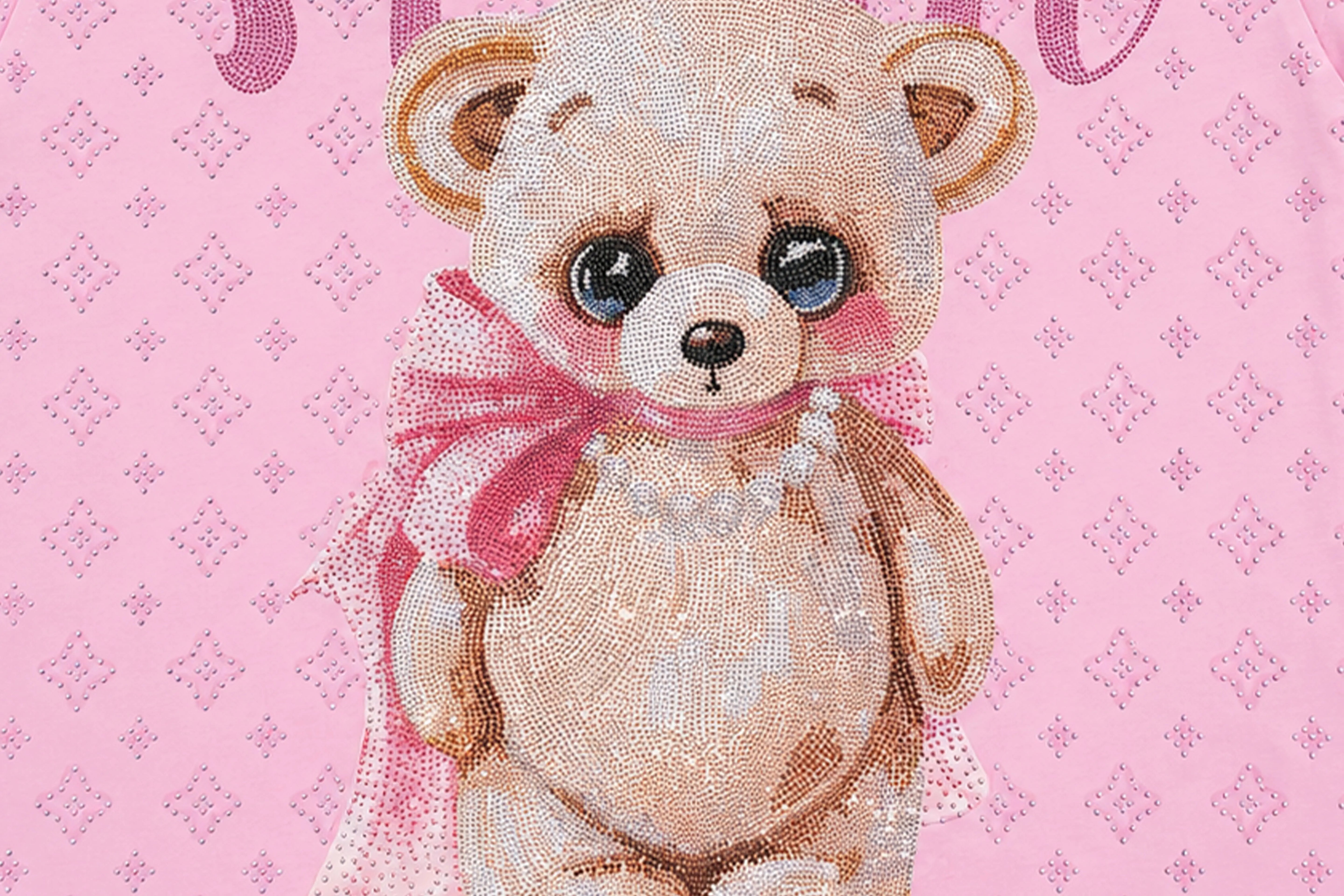 A close-up of a pink patterned fabric featuring a cute teddy bear illustration with large blue eyes, a pink bow, and a pearl necklace. TCH Cute Teddy Bear Rhinestone Oversized T-Shirt Dress