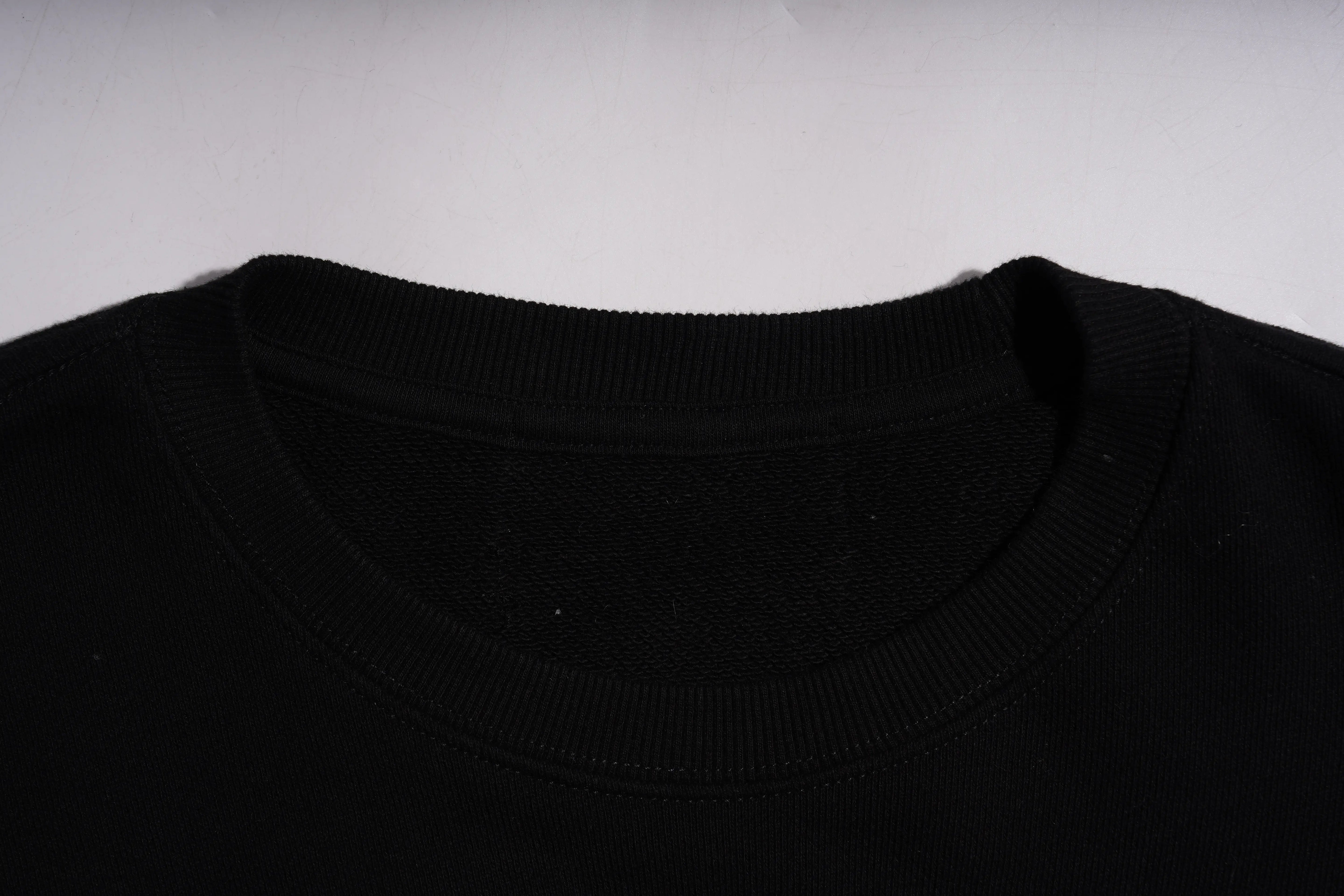 Close-up of a black sweater collar on a white background, TCH Dragon Embroidered Rhinestone Sweatshirt-
