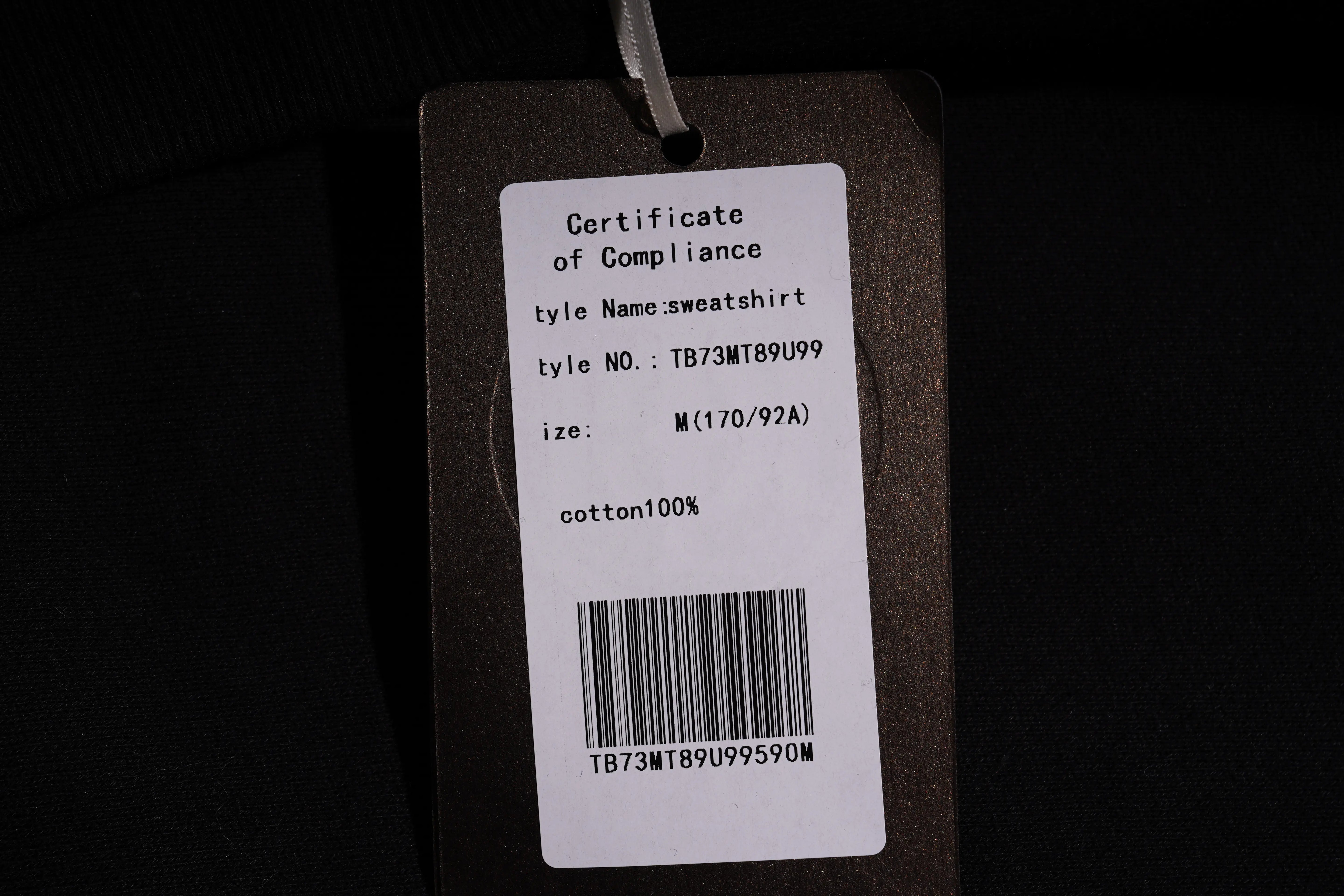 Product tag with text and barcode on a dark background