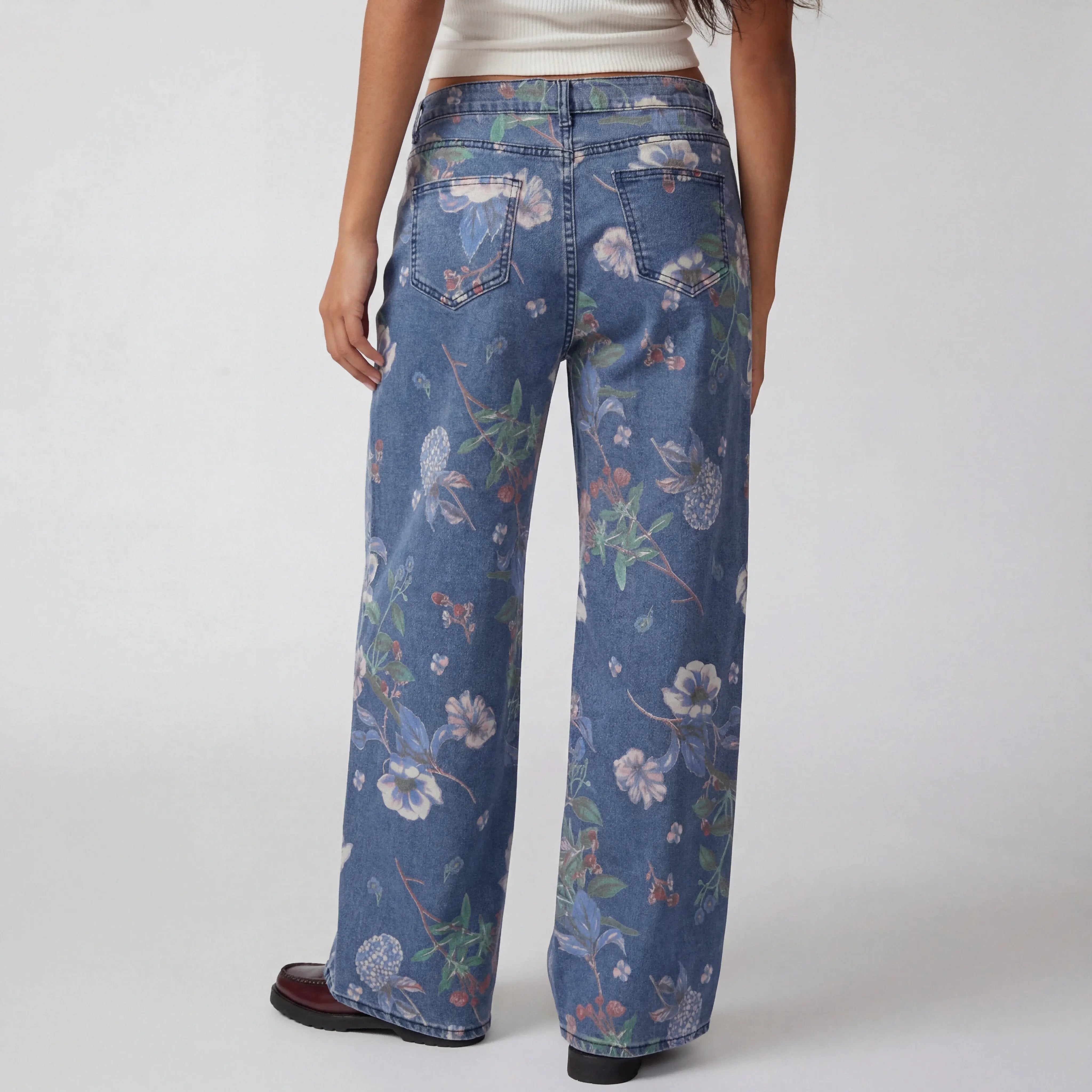 Floral-patterned jeans worn by a person on a white background, TCH Floral Print Rhinestone Butterfly Denim Jeans