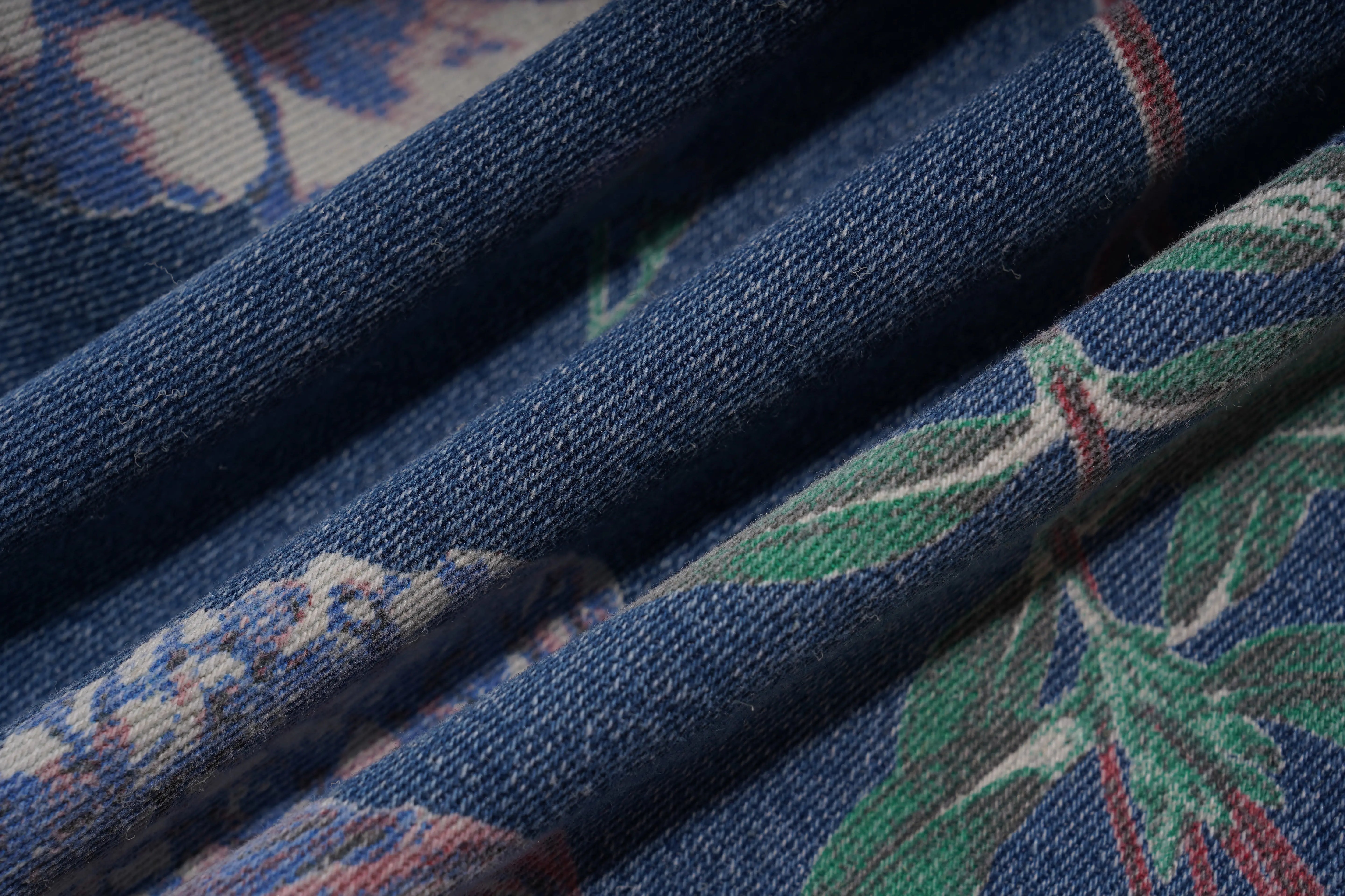 Close-up of blue fabric with floral pattern, TCH Floral Print Rhinestone Butterfly Denim Jeans
