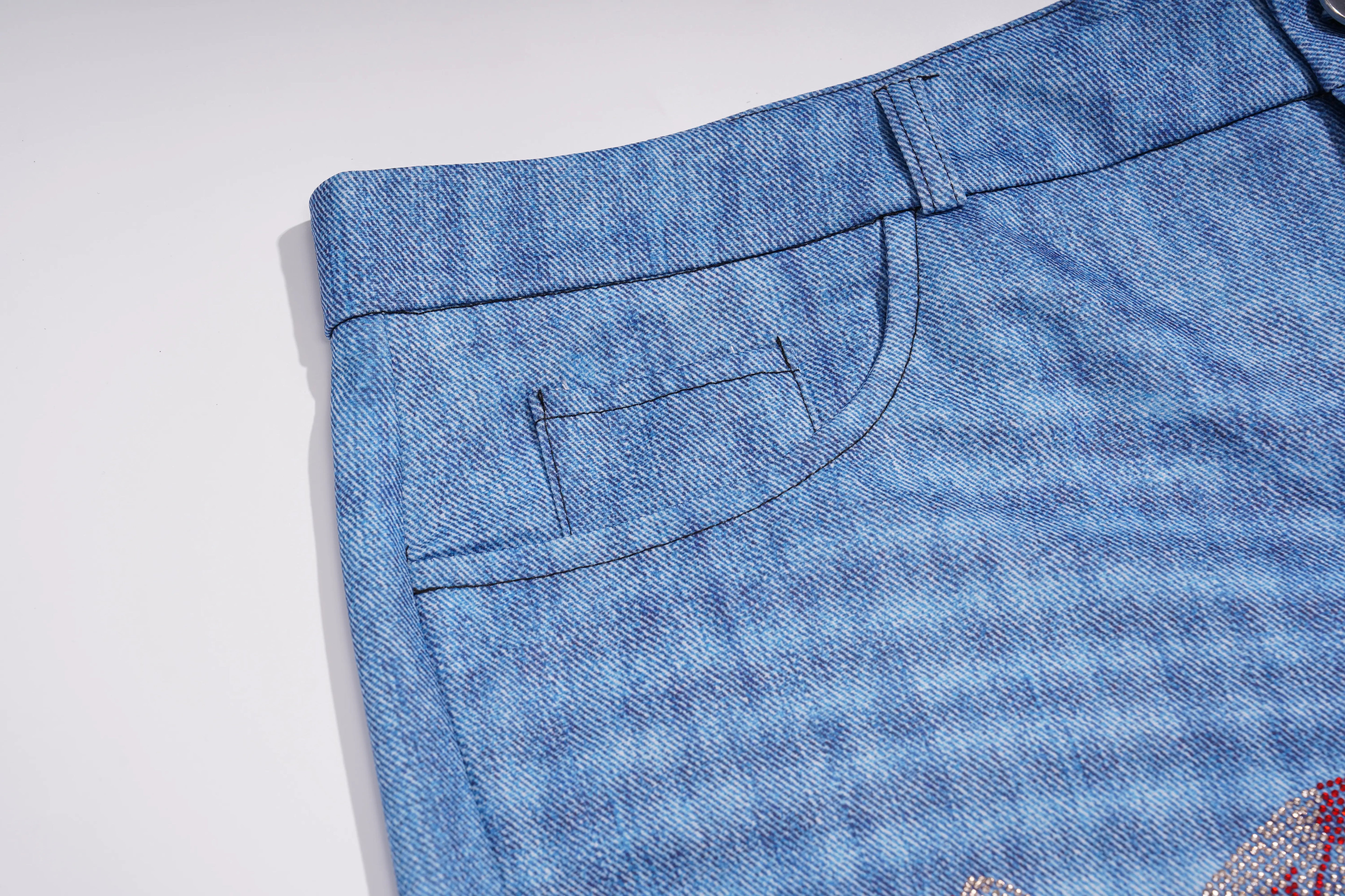 Close-up of the waistband and back pocket of blue denim jeans on a plain white background. TCH Floral Rhinestone Wide Leg Denim Jeans