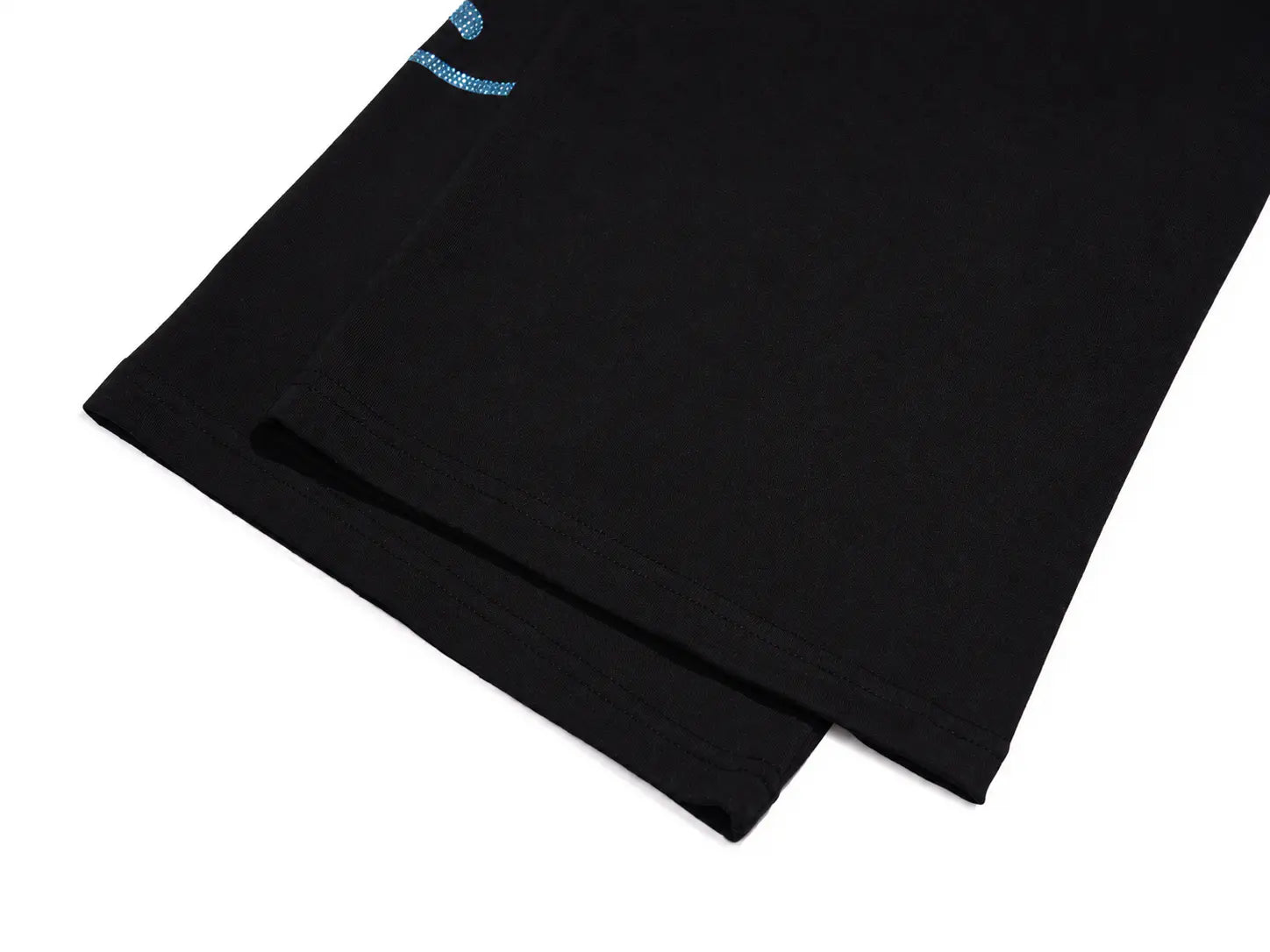 A close-up of a black folded garment, likely a sweatshirt or jacket sleeve, showing a small light blue embroidered logo near the top edge, set against a plain white background. TCH Galaxy Rhinestone Wide Leg Sweatpants
