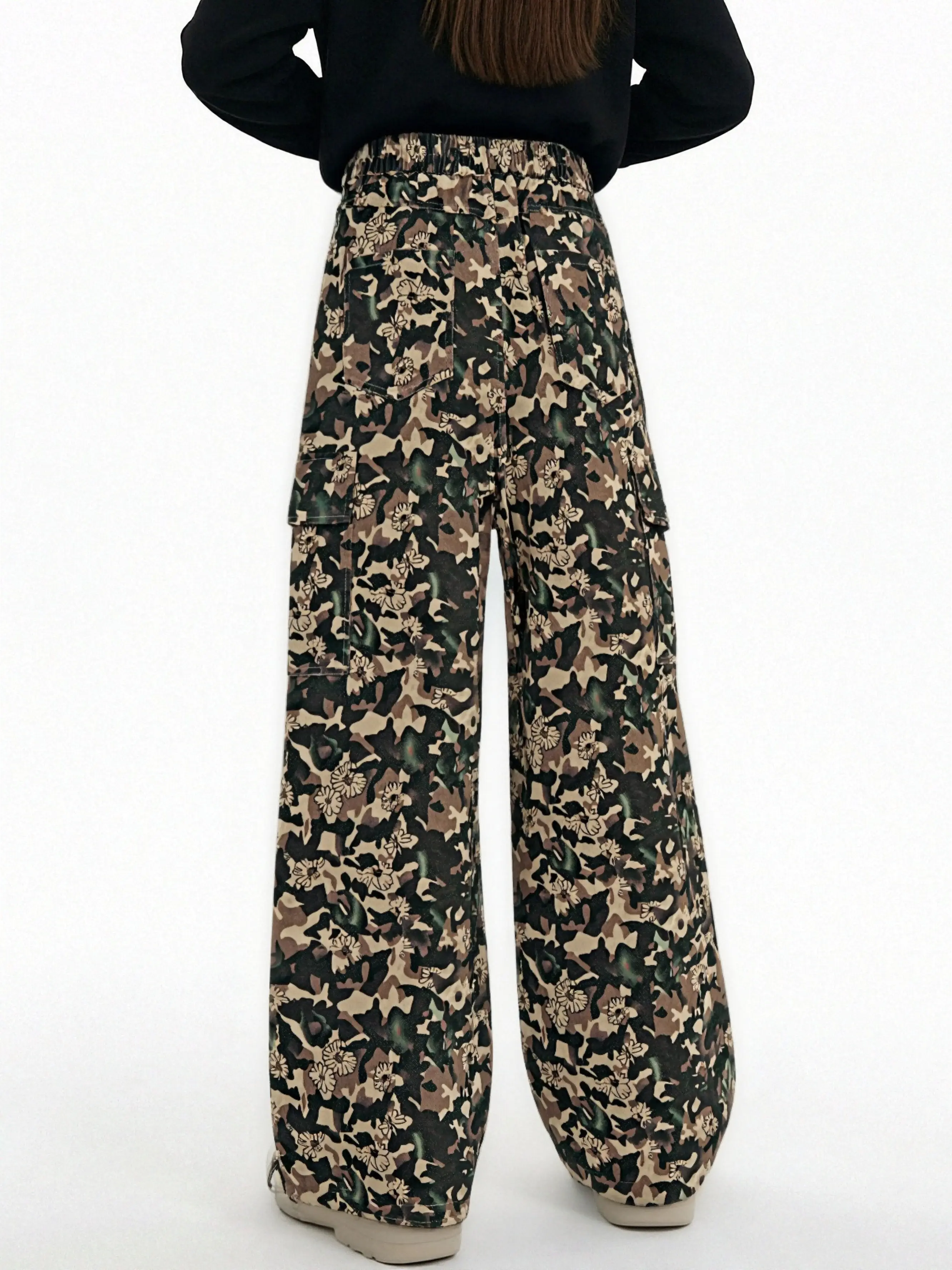 Camouflage-patterned pants worn by a person on a white background, TCH Gold Snowflake Rhinestone Camo Denim Jeans