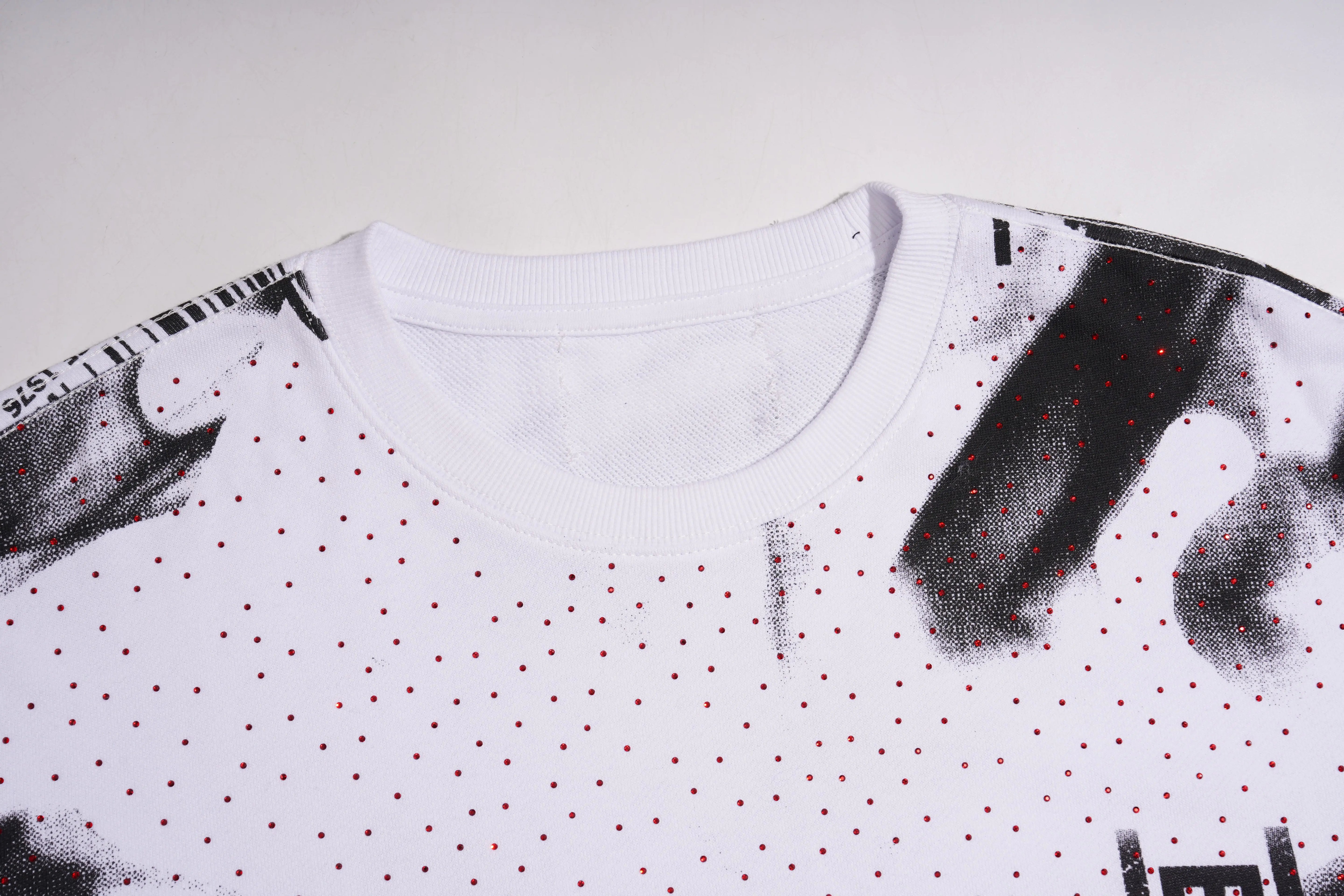 White t-shirt with black and red pattern on a white background, TCH Graffiti Logo Print Crewneck Sweatshirt