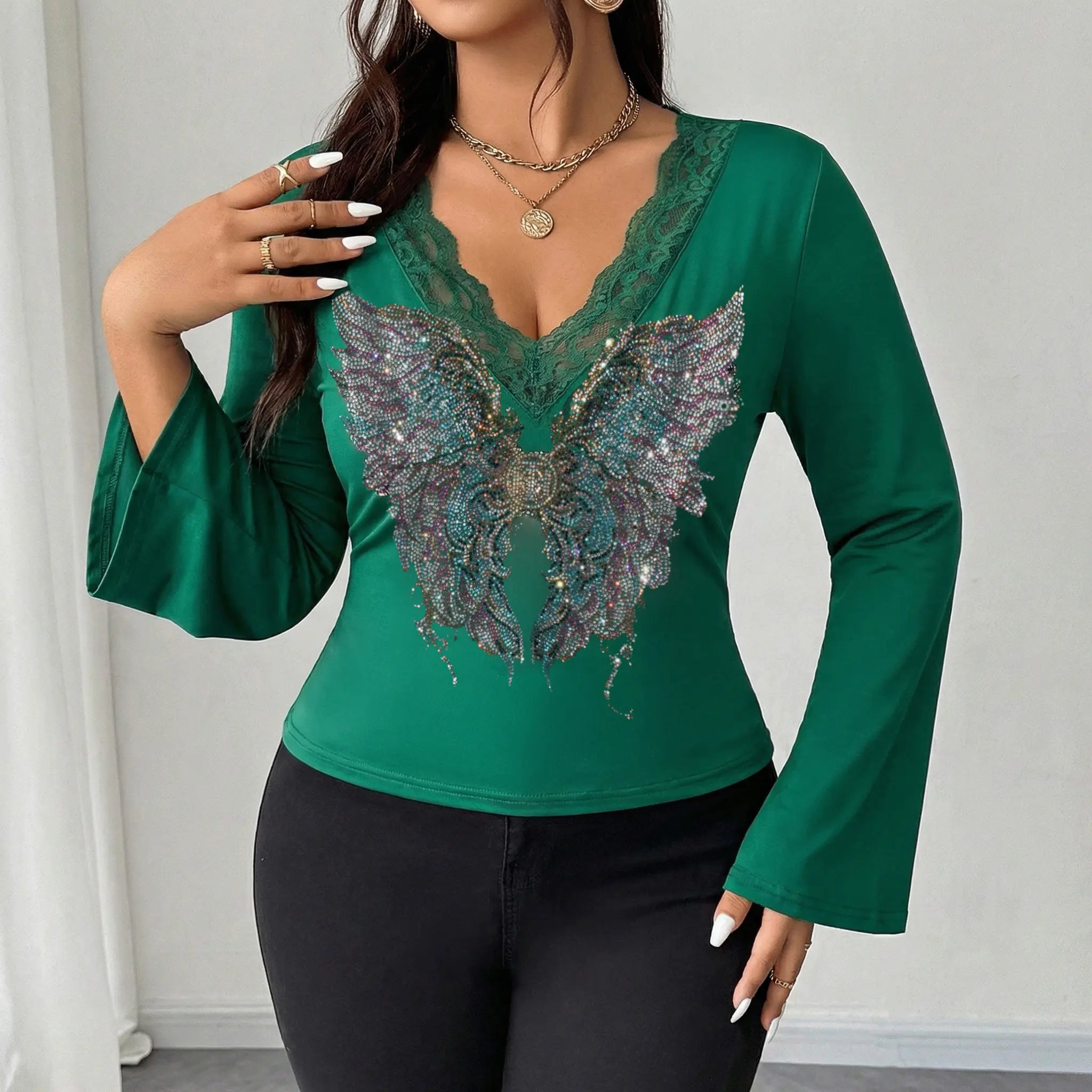 Green long-sleeve top with butterfly design worn by a model against a plain background, TCH Green Lace Trim V-Neck Rhinestone Wing Long Sleeve Top