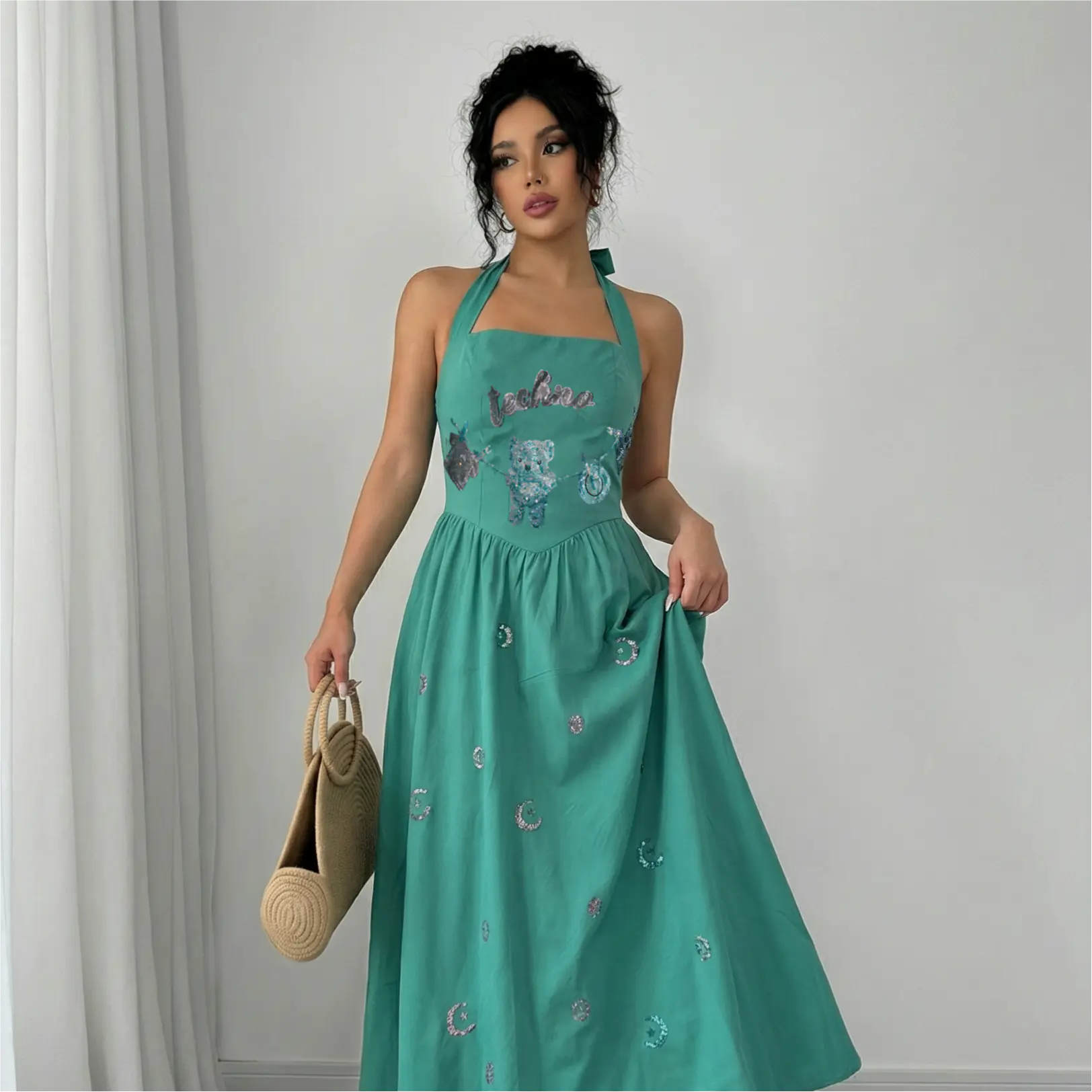 Woman wearing a teal dress with embroidery against a plain background, TCH Green Rhinestone Teddy Laundry Story Dress