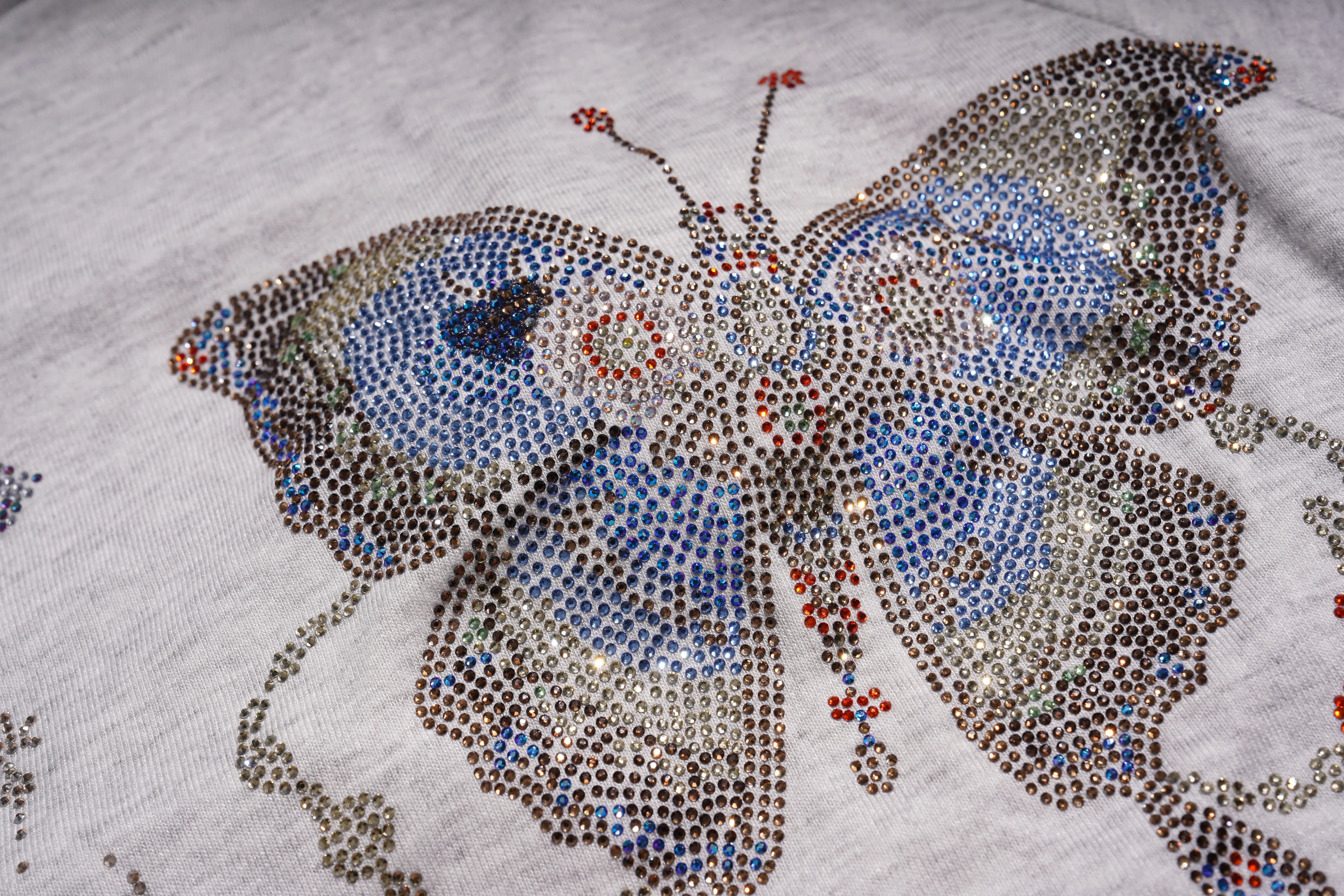 Butterfly design made of small stones on a textured surface, TCH Grey Rhinestone Butterfly Pajama Set