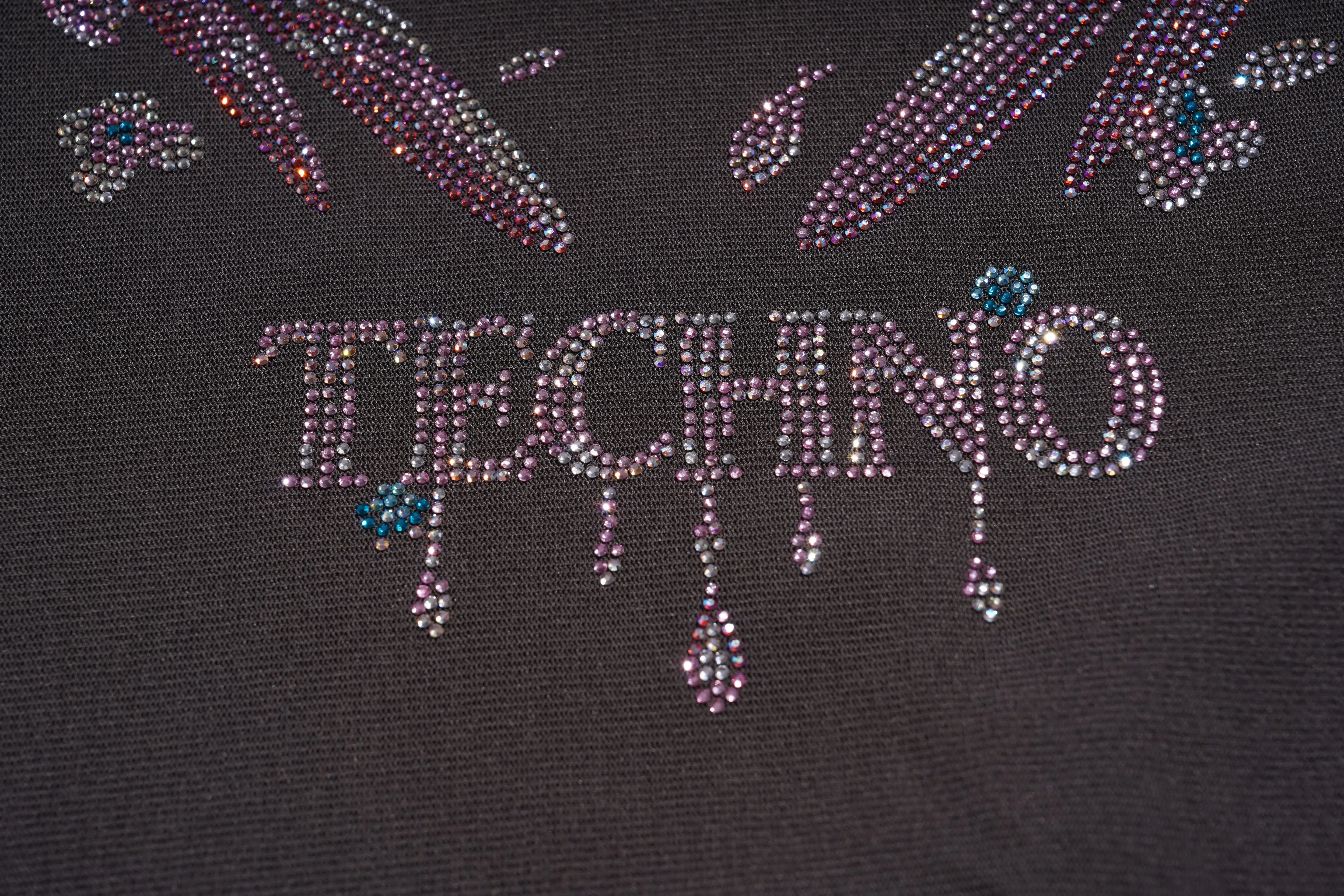 Text 'TECHNO' made of rhinestones on a black background, TCH Grey Rhinestone Pink Wings Graphic T-Shirt