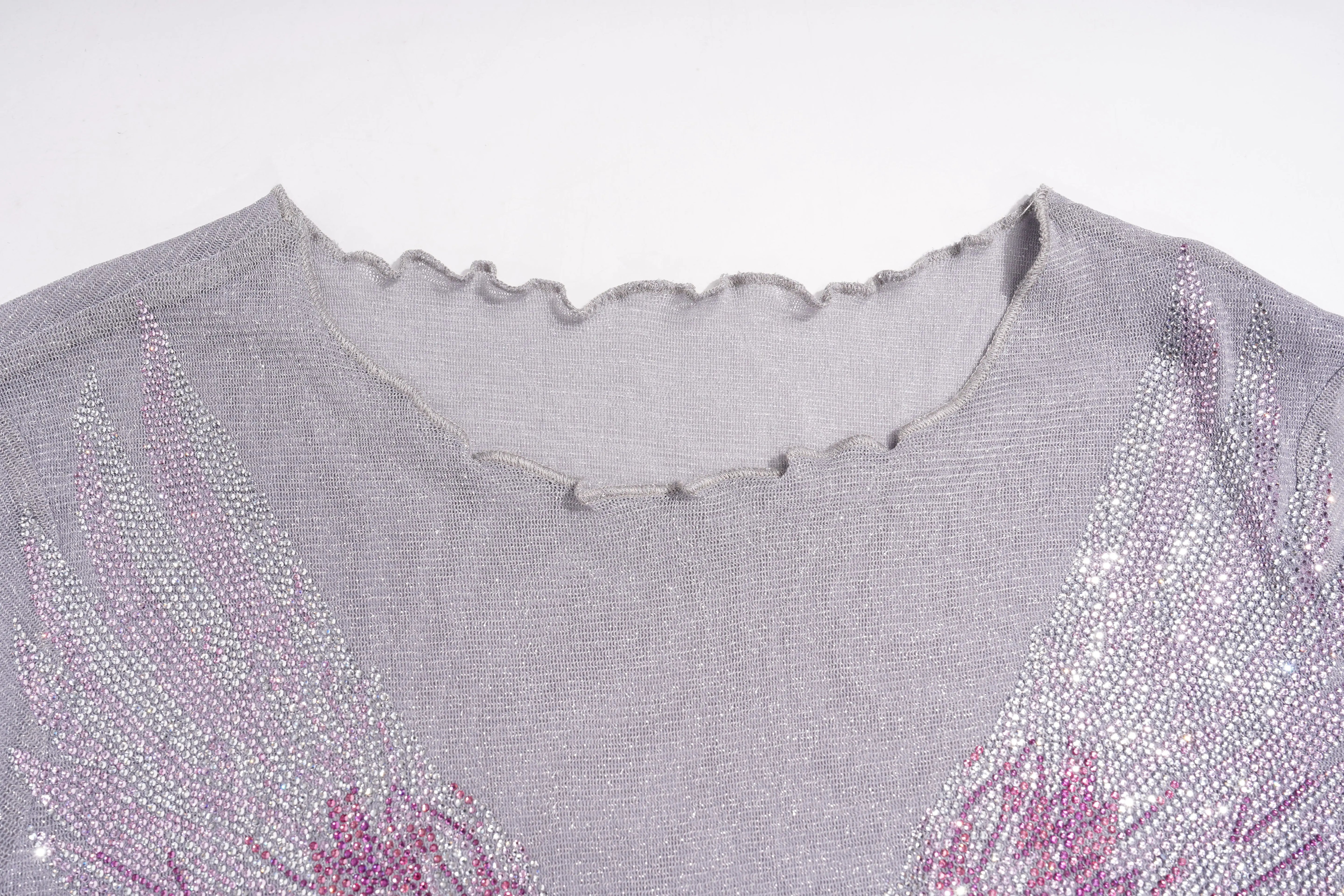 Close-up of a gray garment with pink floral embroidery on a white background, TCH Grey Rhinestone Purple Wings Long Sleeve Top