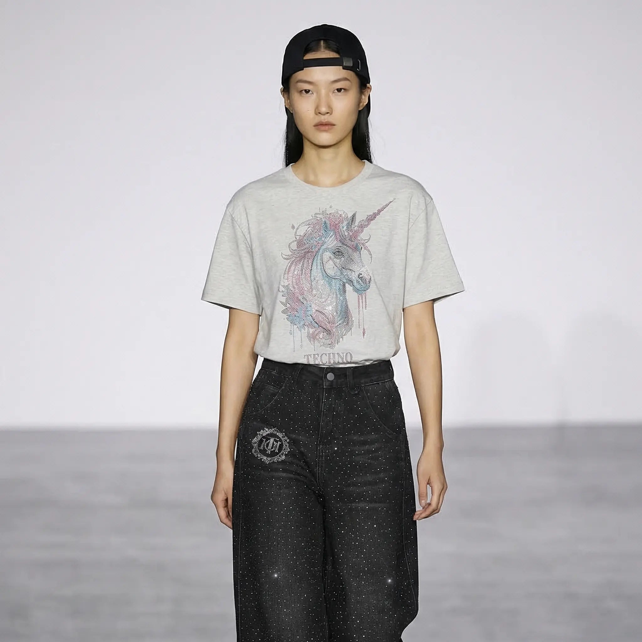 Person wearing a t-shirt with a unicorn design on a plain background, TCH Grey Rhinestone Unicorn Graphic T-Shirt