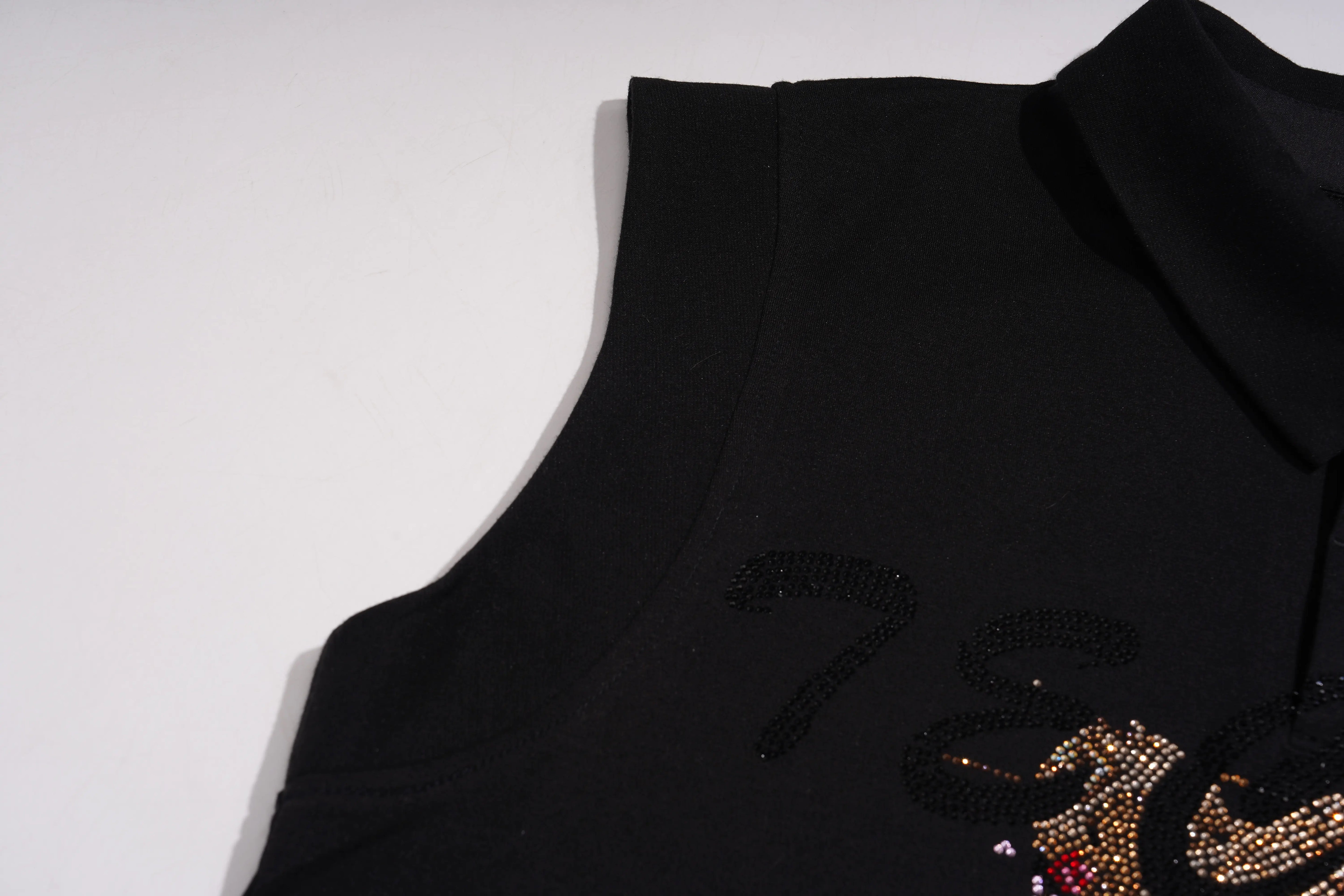 Black sleeveless top with decorative elements on a white background, TCH Leopard Rhinestone Sleeveless Polo Shirt