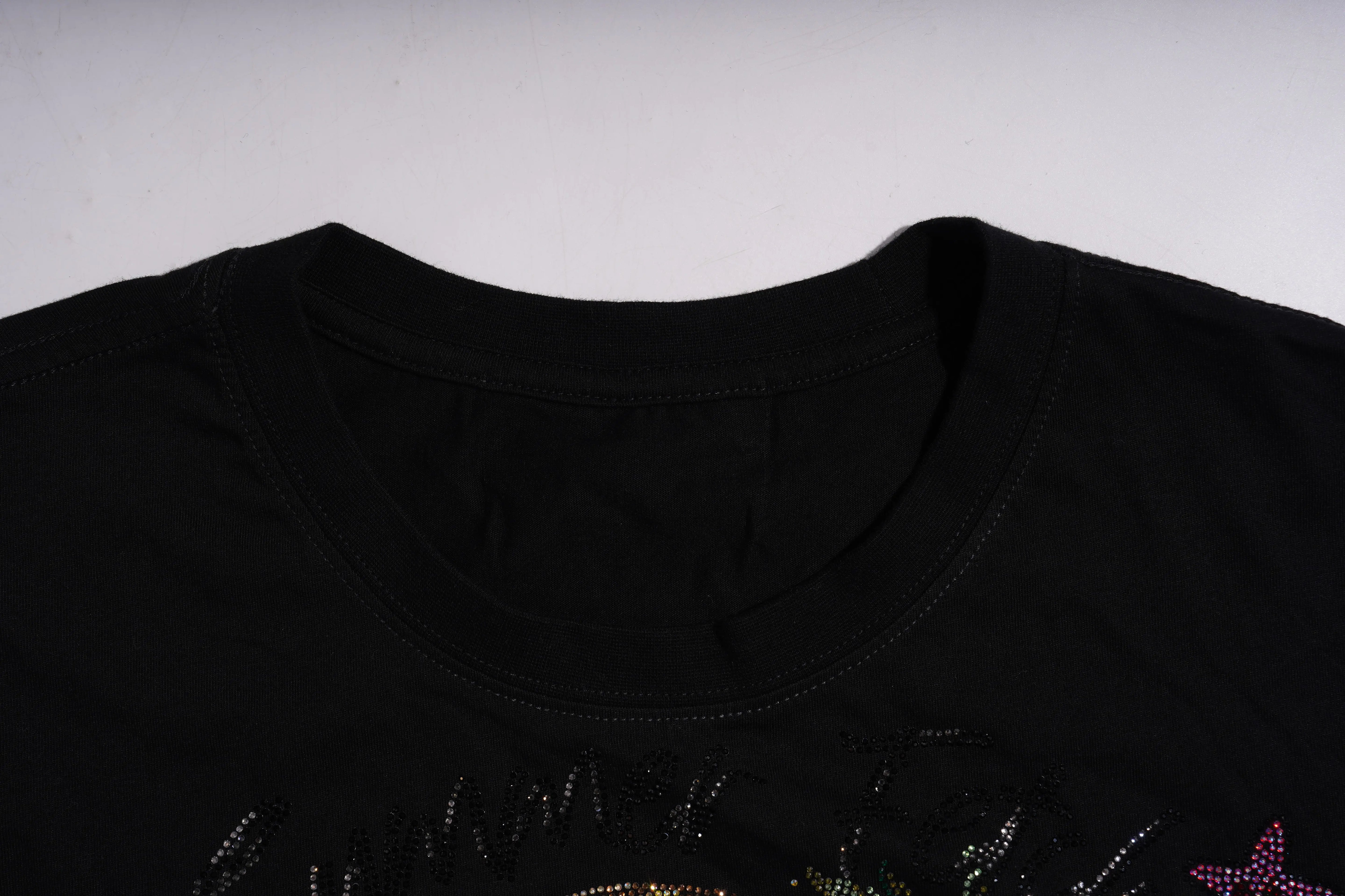 Black shirt with colorful designs on a white background, TCH Luck Dog Rhinestone T-Shirt